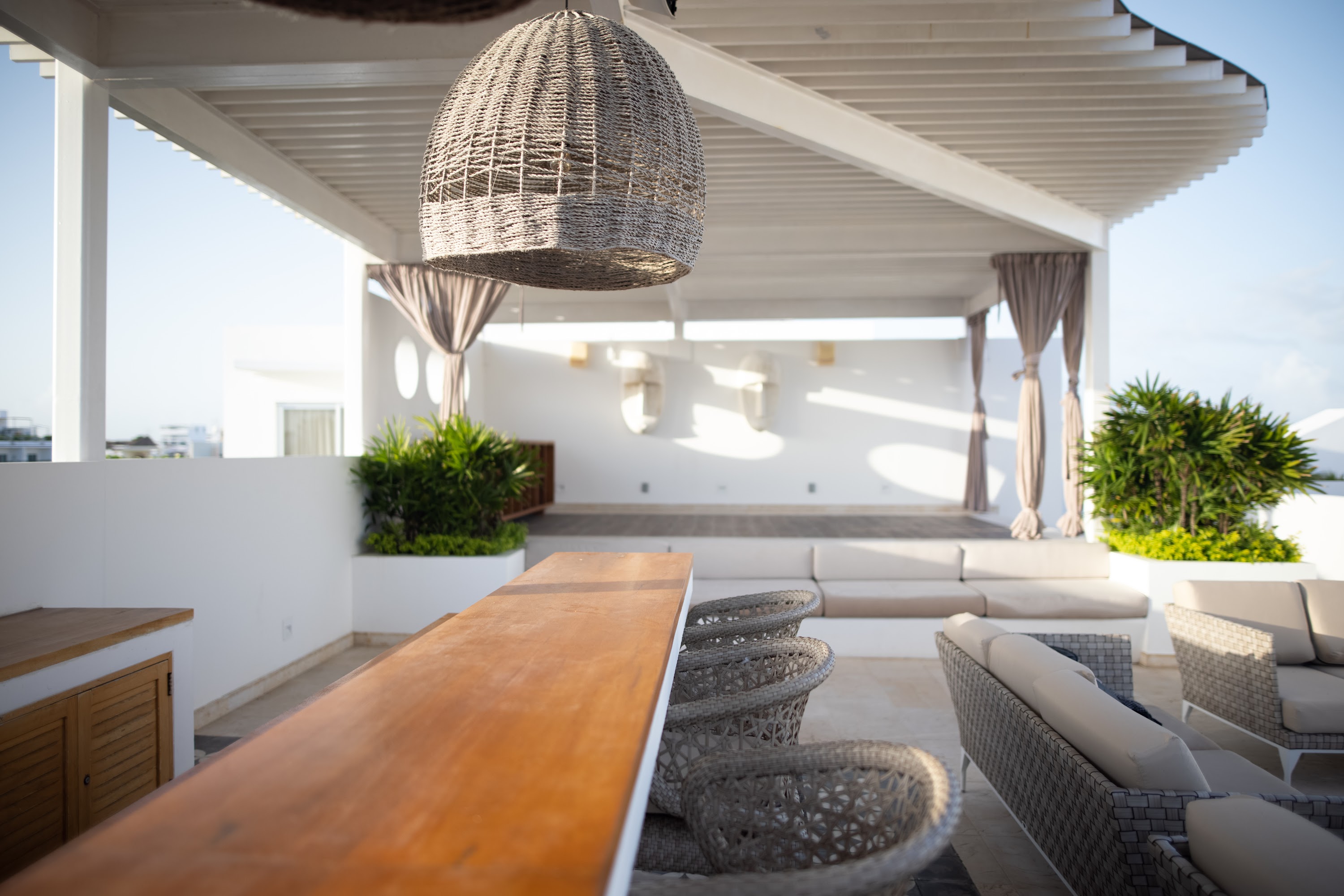 Rooftop Terrace with Woven Lighting and Outdoor Seating