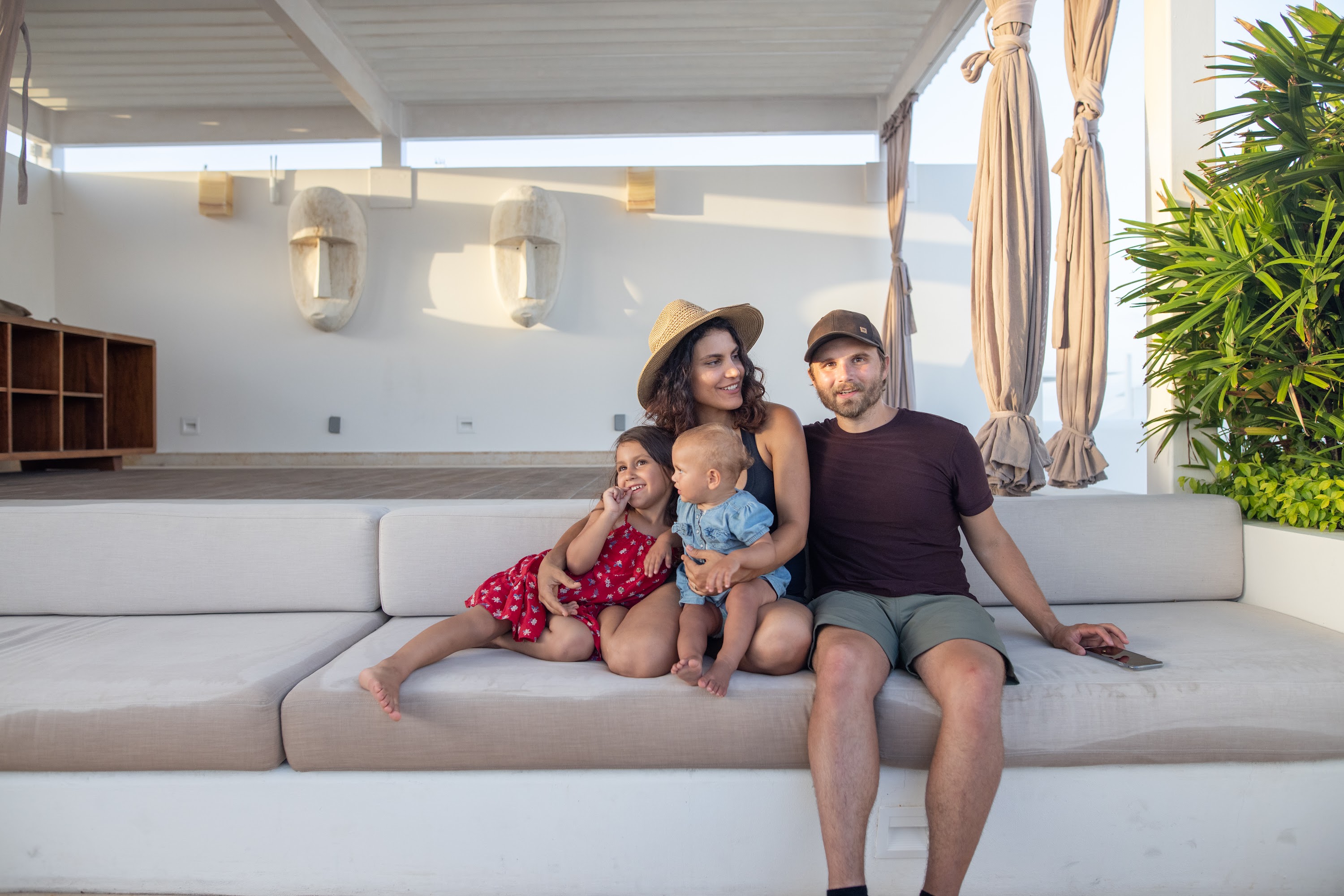 Family of Four Relaxing on Outdoor Patio