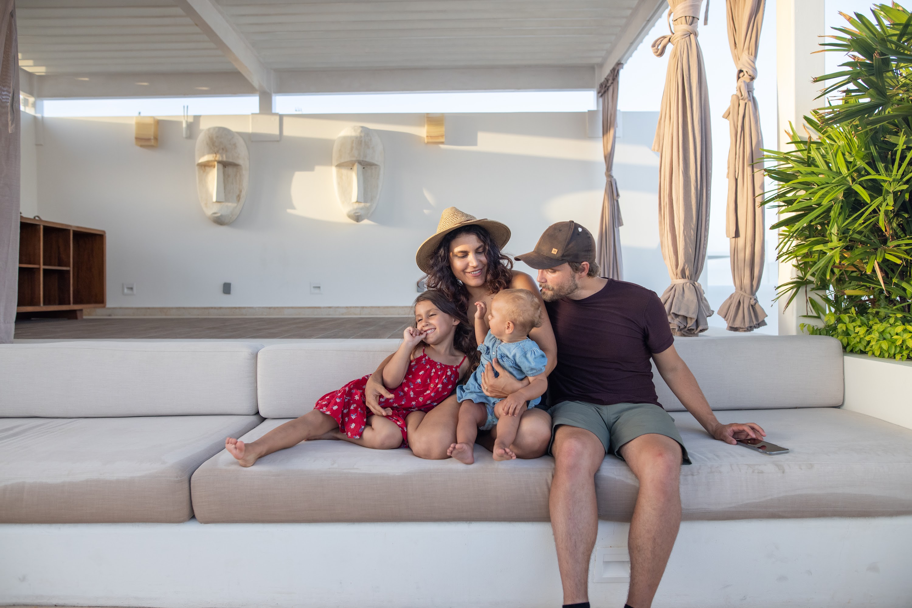 Family of Four Relaxing on Outdoor Patio