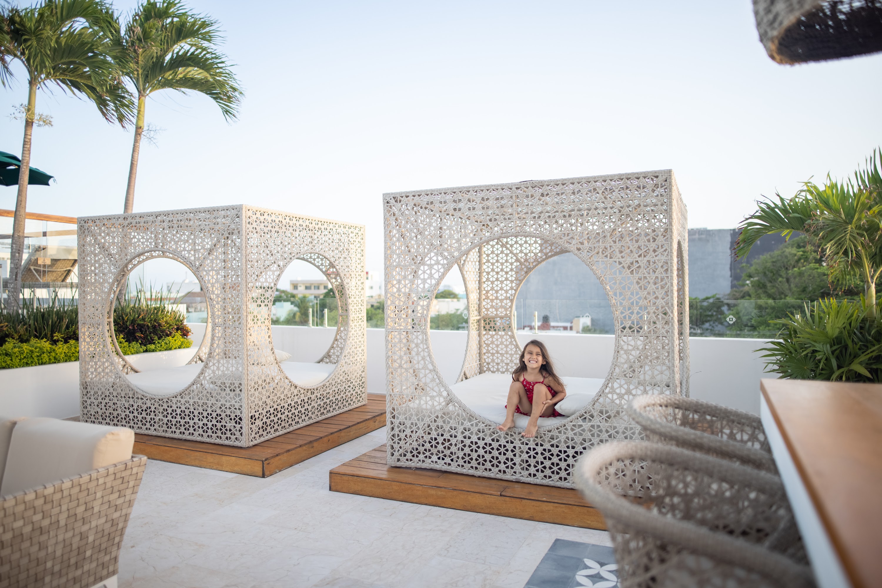 Girl Relaxing in Modern Outdoor Loungers on Rooftop Terrace