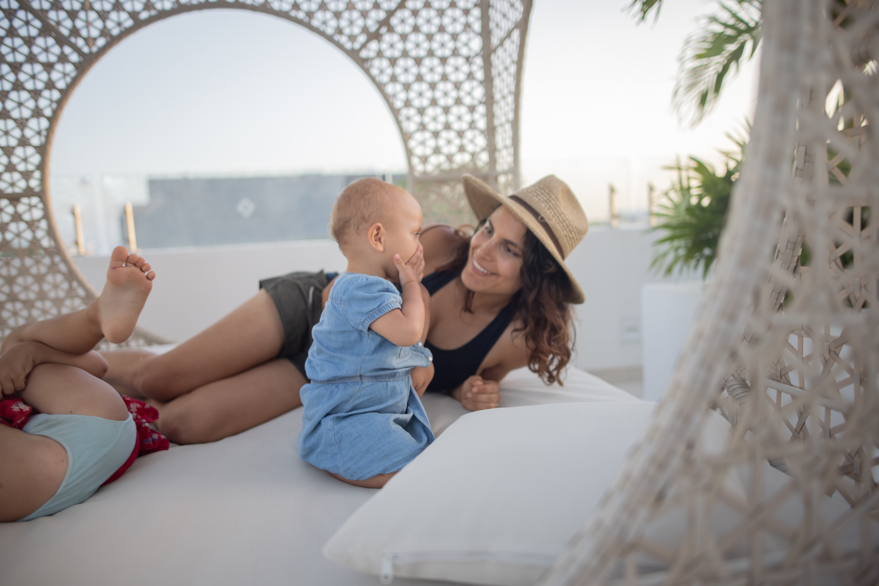 Mother and Baby Sharing a Moment on Rooftop Lounge