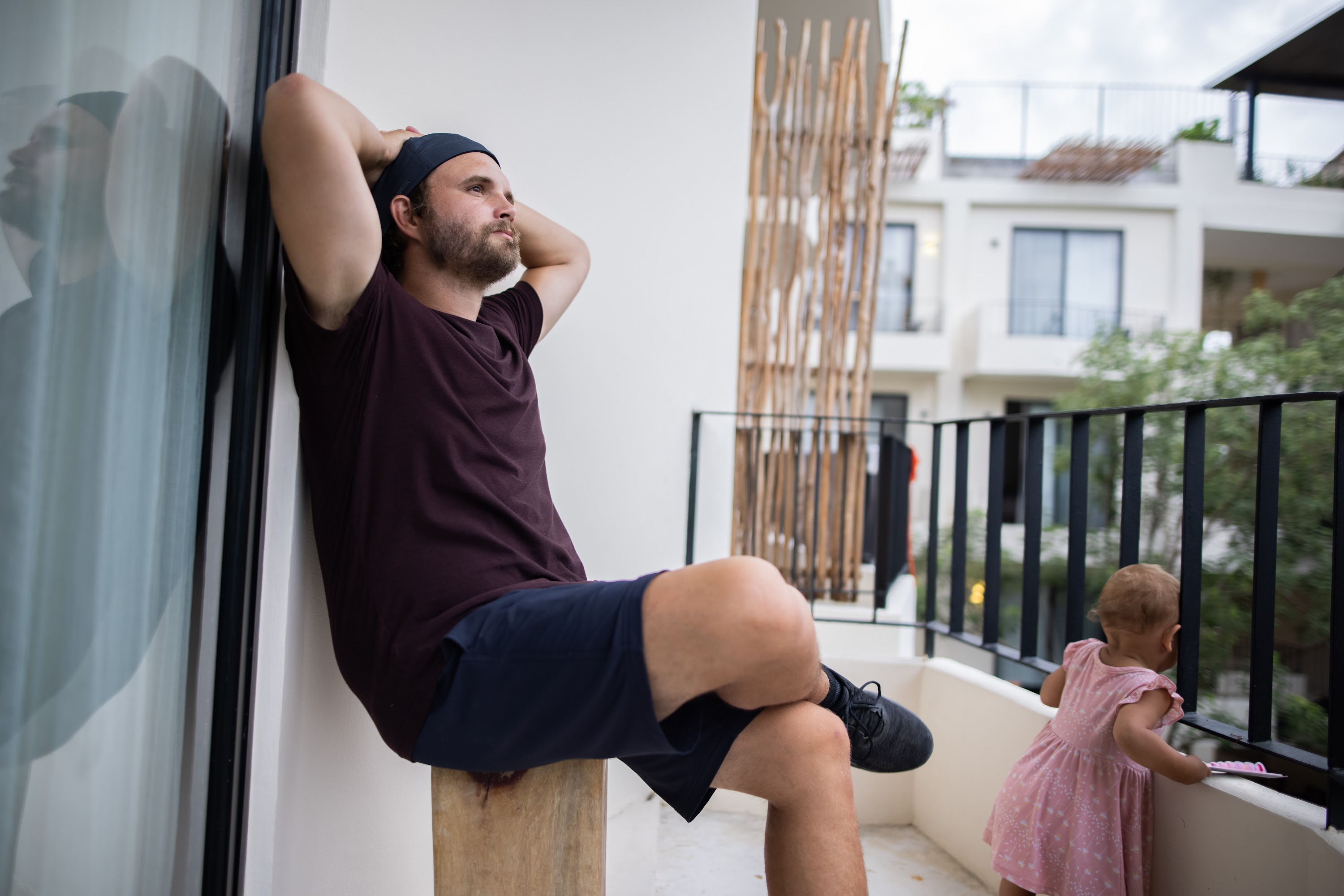 Man and toddler on balcony