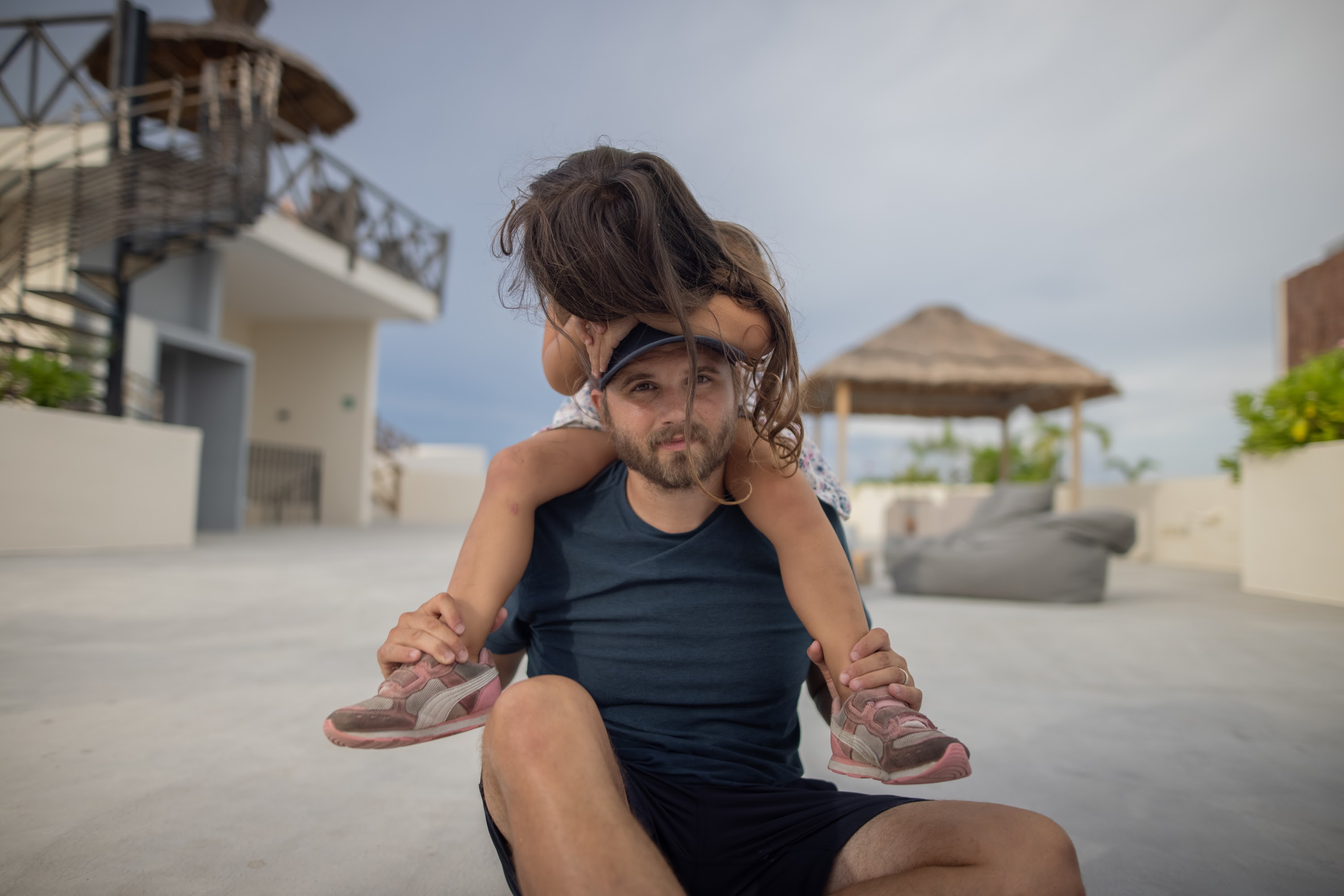 Father and Daughter Playing on Rooftop Terrace