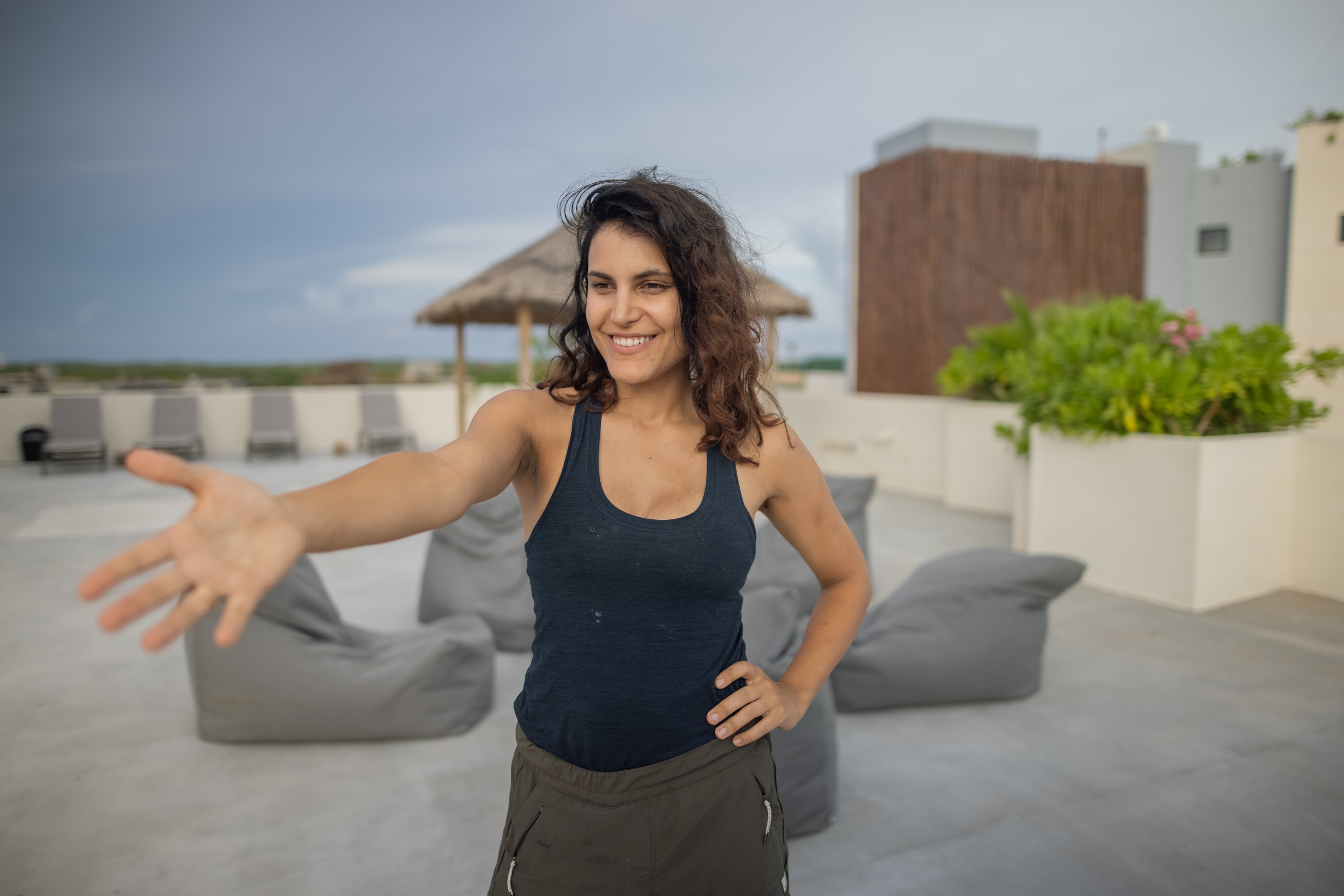 Woman Welcoming on Rooftop Terrace