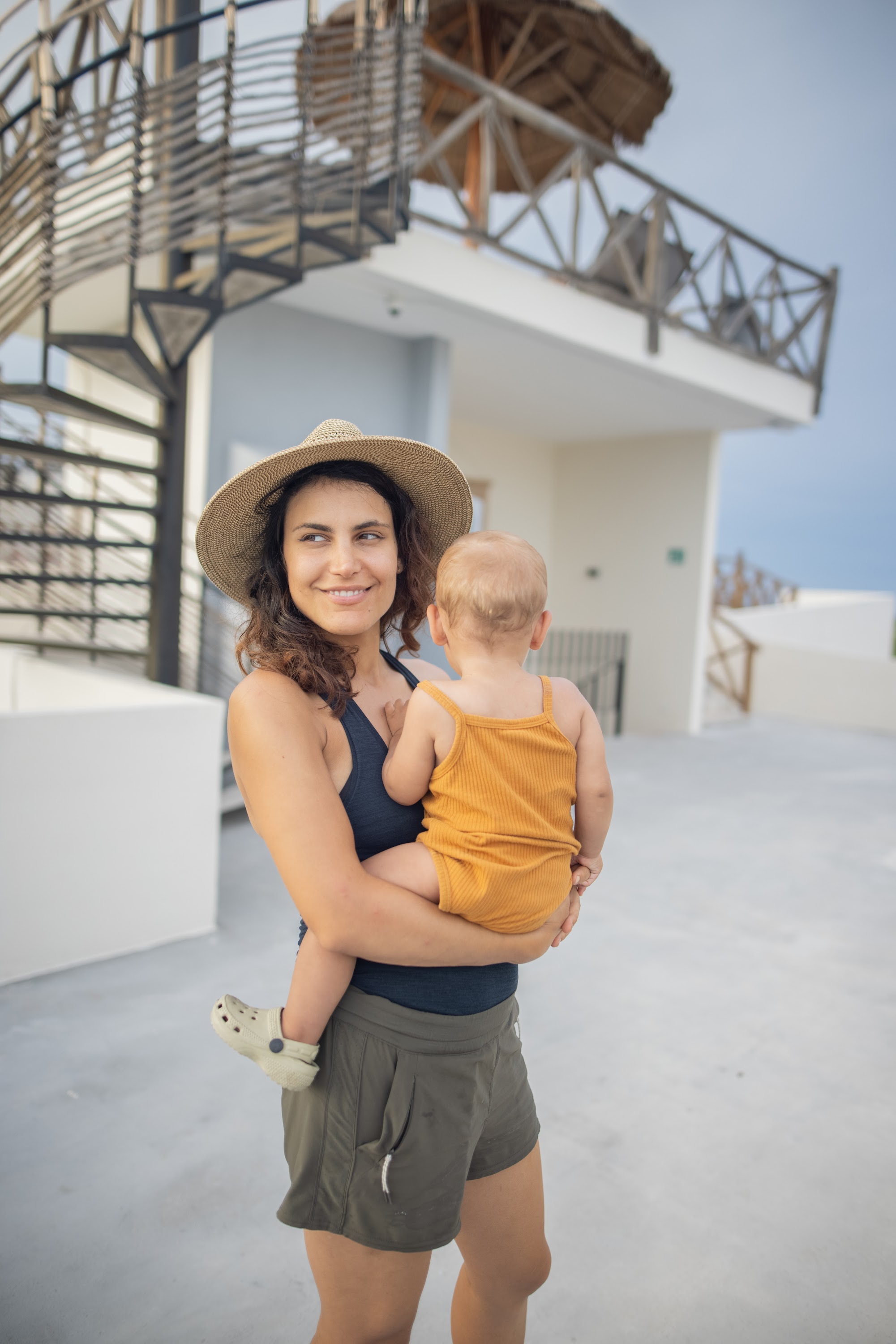 Mother Holding Baby on Rooftop Terrace