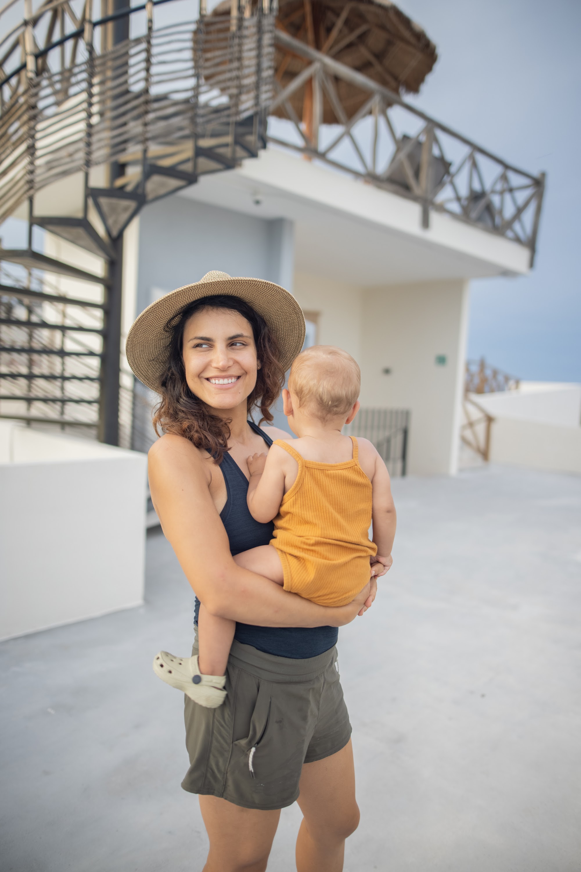 Mother Holding Baby on Rooftop Terrace