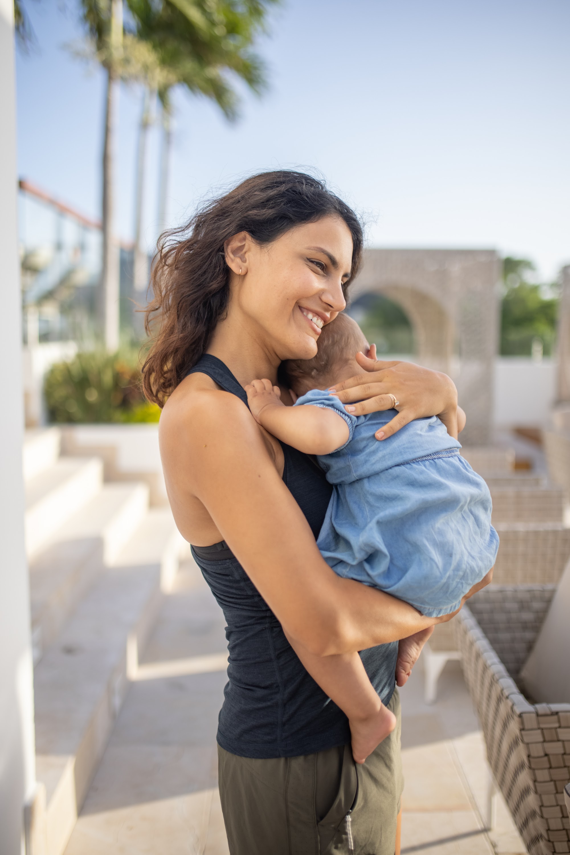 Mother Holding Baby Outdoors