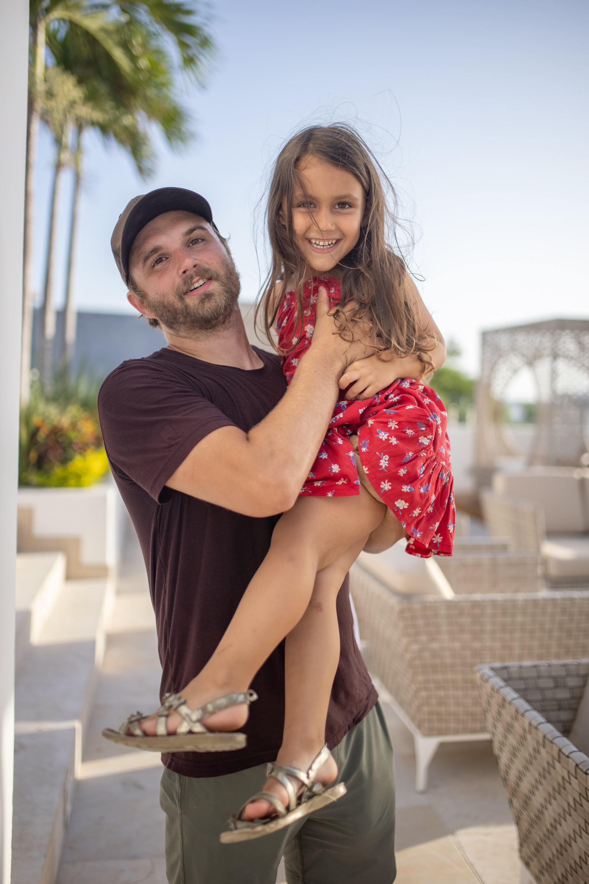Father Holding Daughter Outdoors