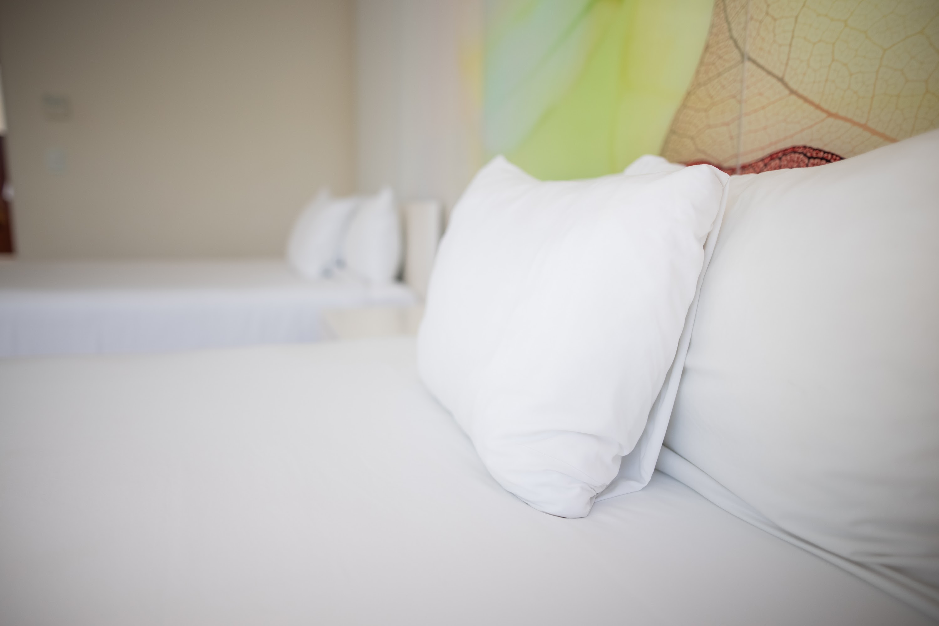 White Pillows on Bed in Hotel Room
