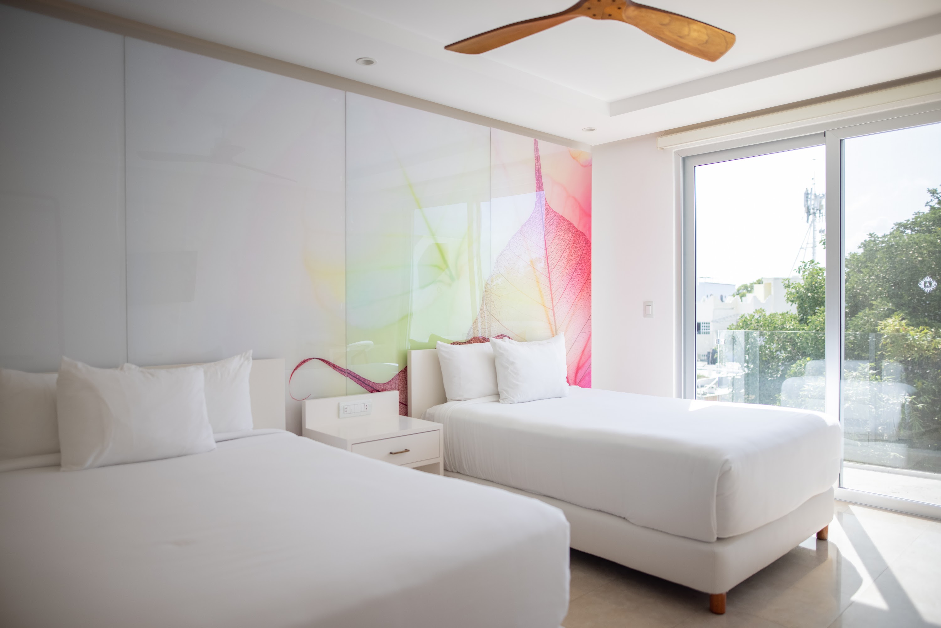 Modern Hotel Room with Two Beds and Colorful Wall Art