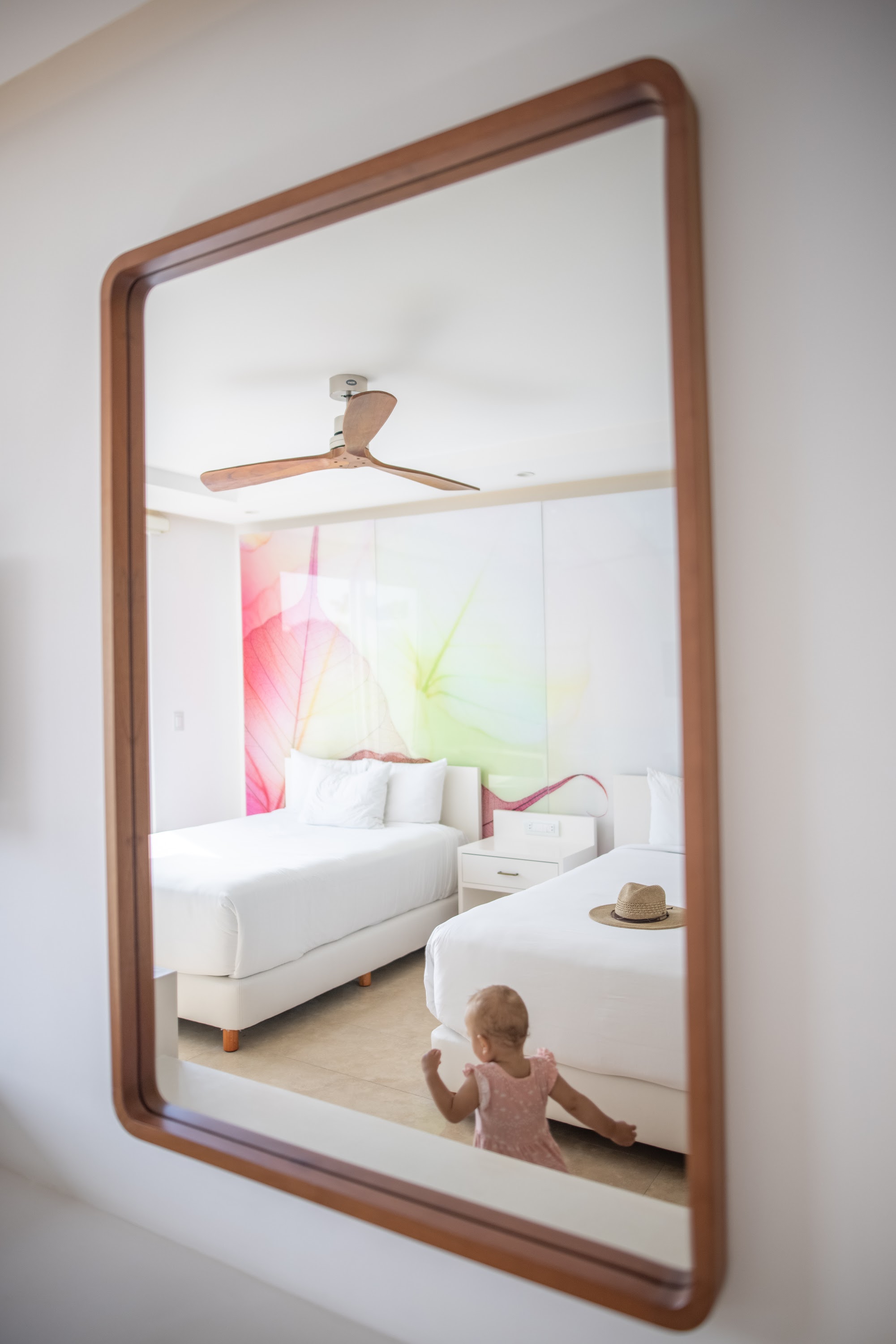 Child Reflecting in Mirror Inside Modern Hotel Room