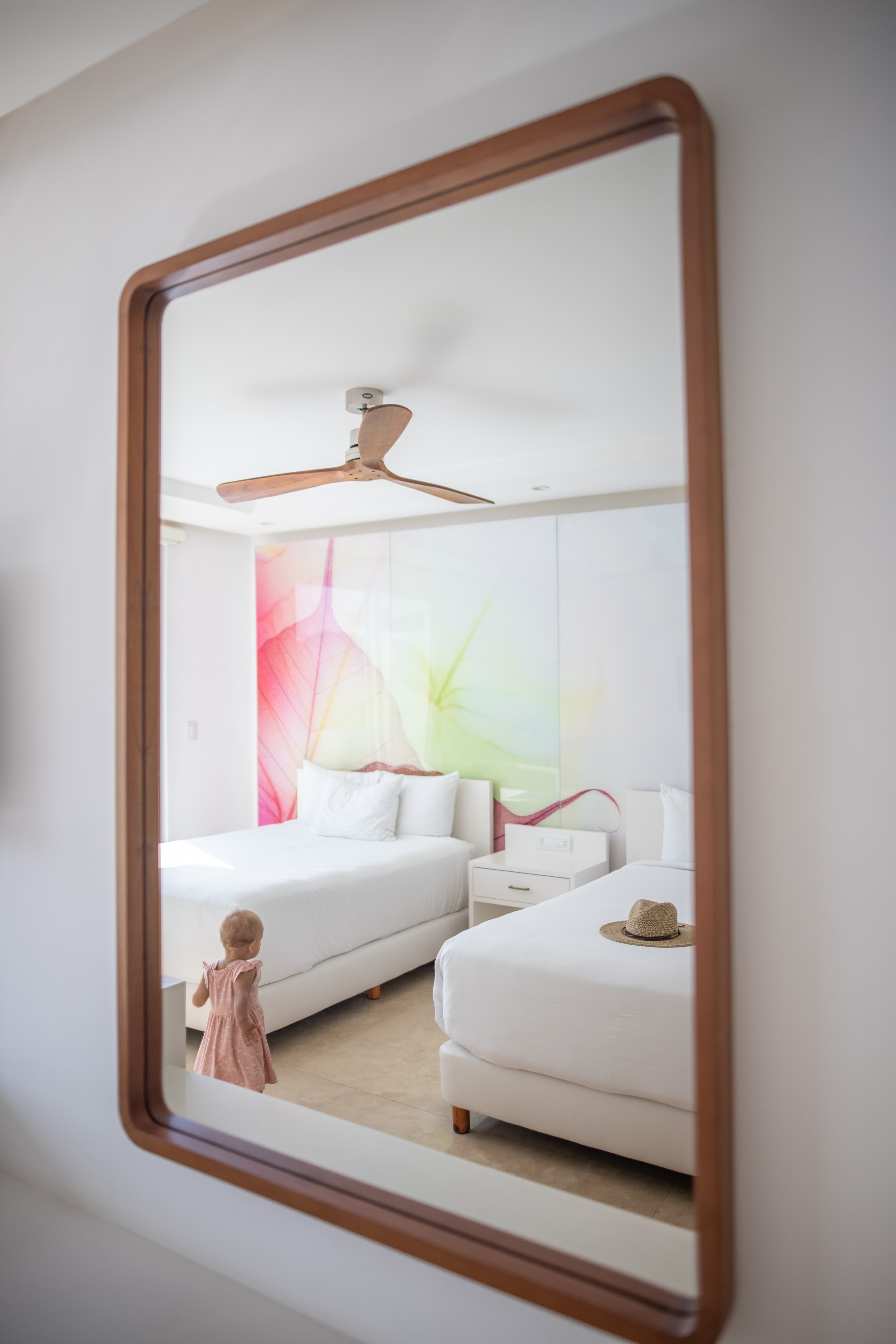 Child Reflecting in Mirror Inside Modern Hotel Room