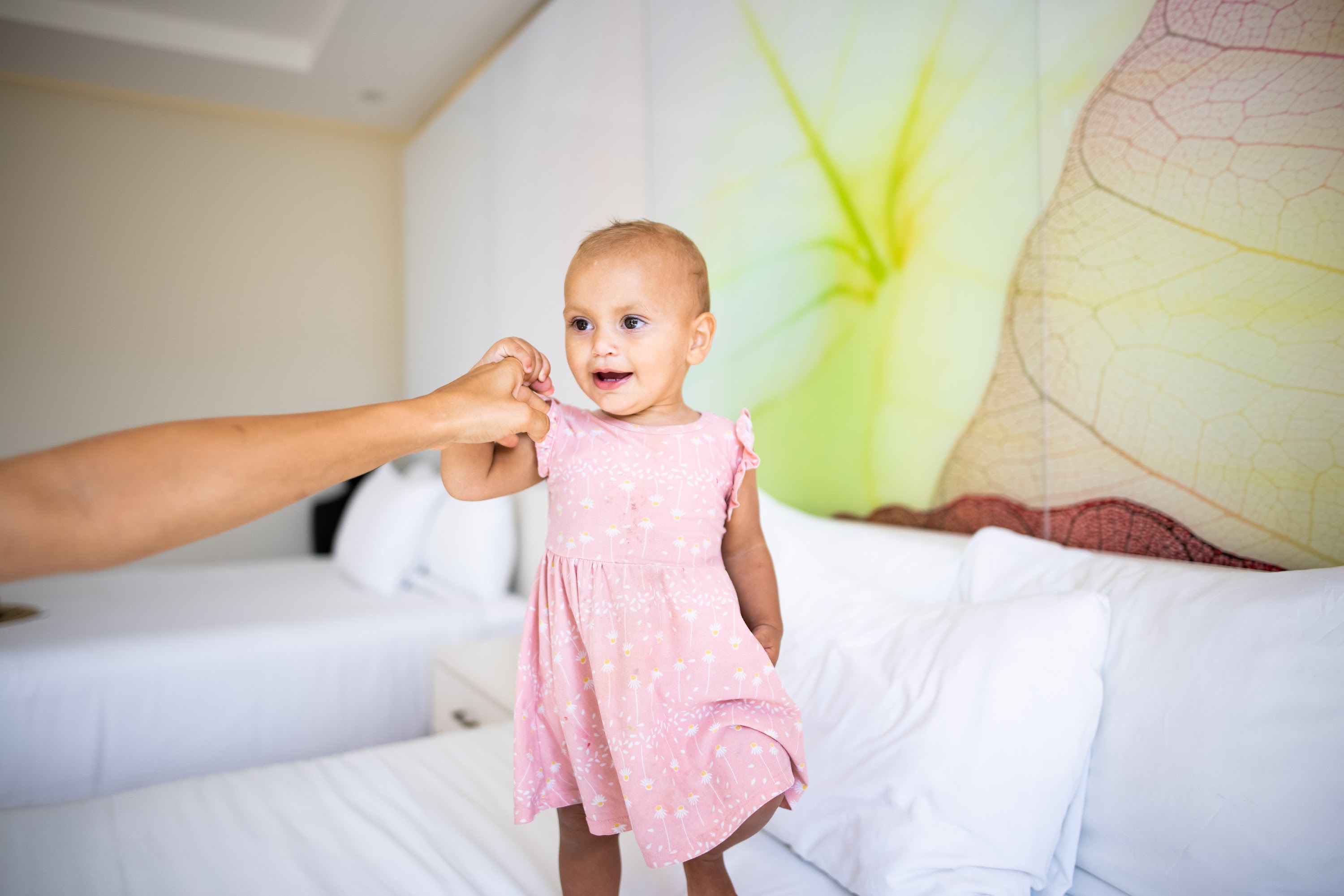 Baby in Pink Dress Holding Adult's Hand
