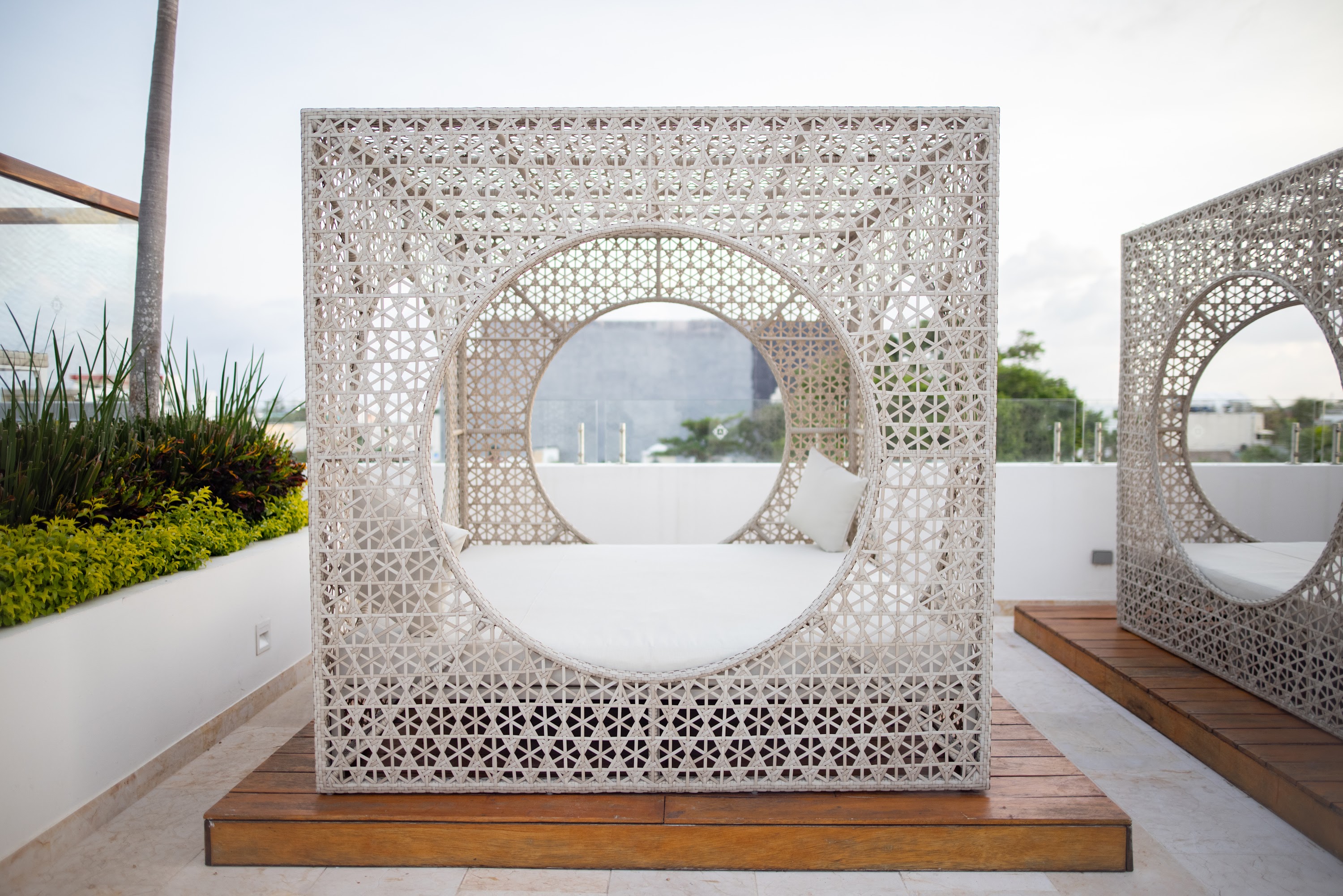 Modern Woven Outdoor Loungers on Rooftop Terrace