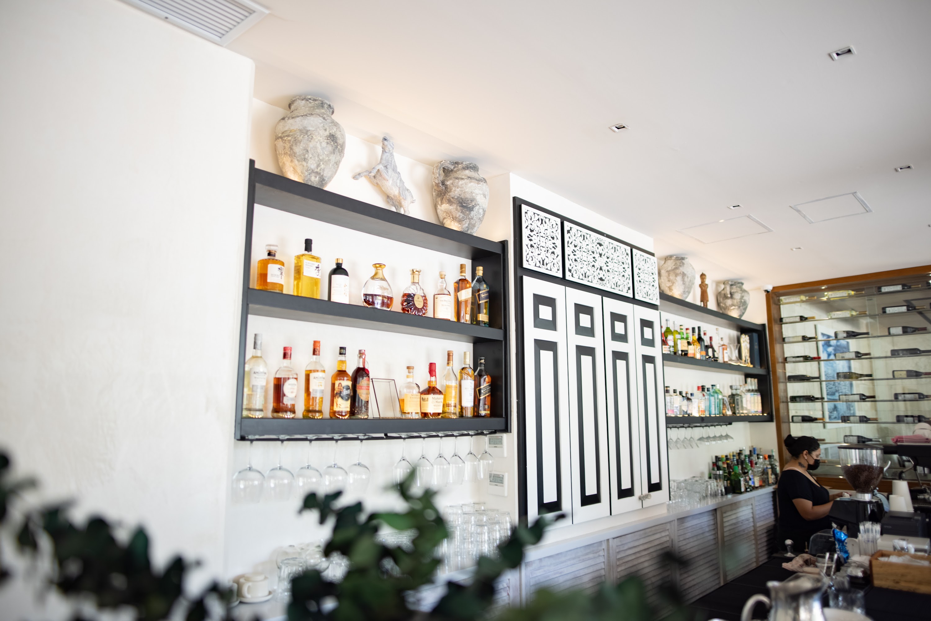Modern Bar Interior with Decorative Shelves and Bottles