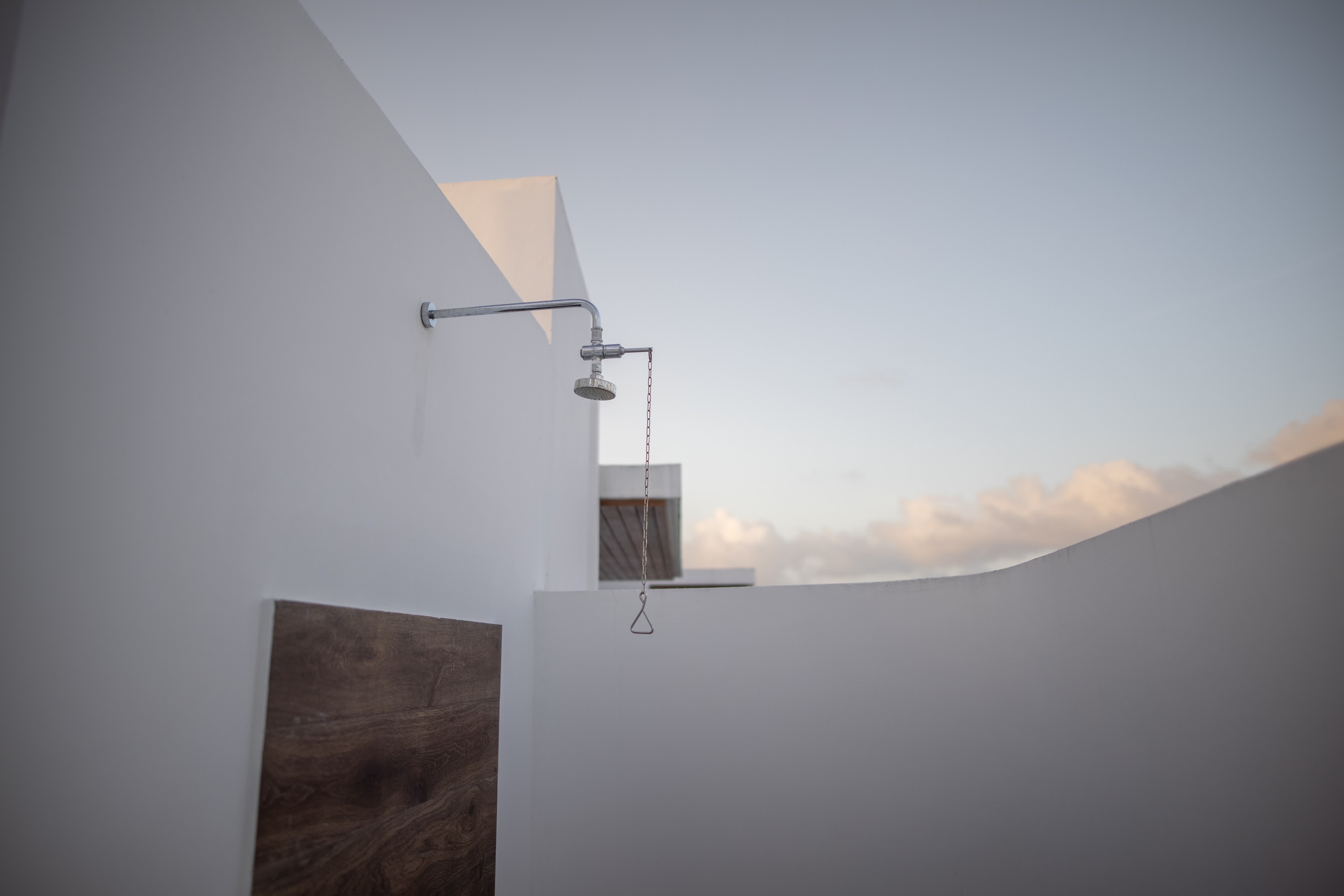 Modern Outdoor Shower Against White Walls