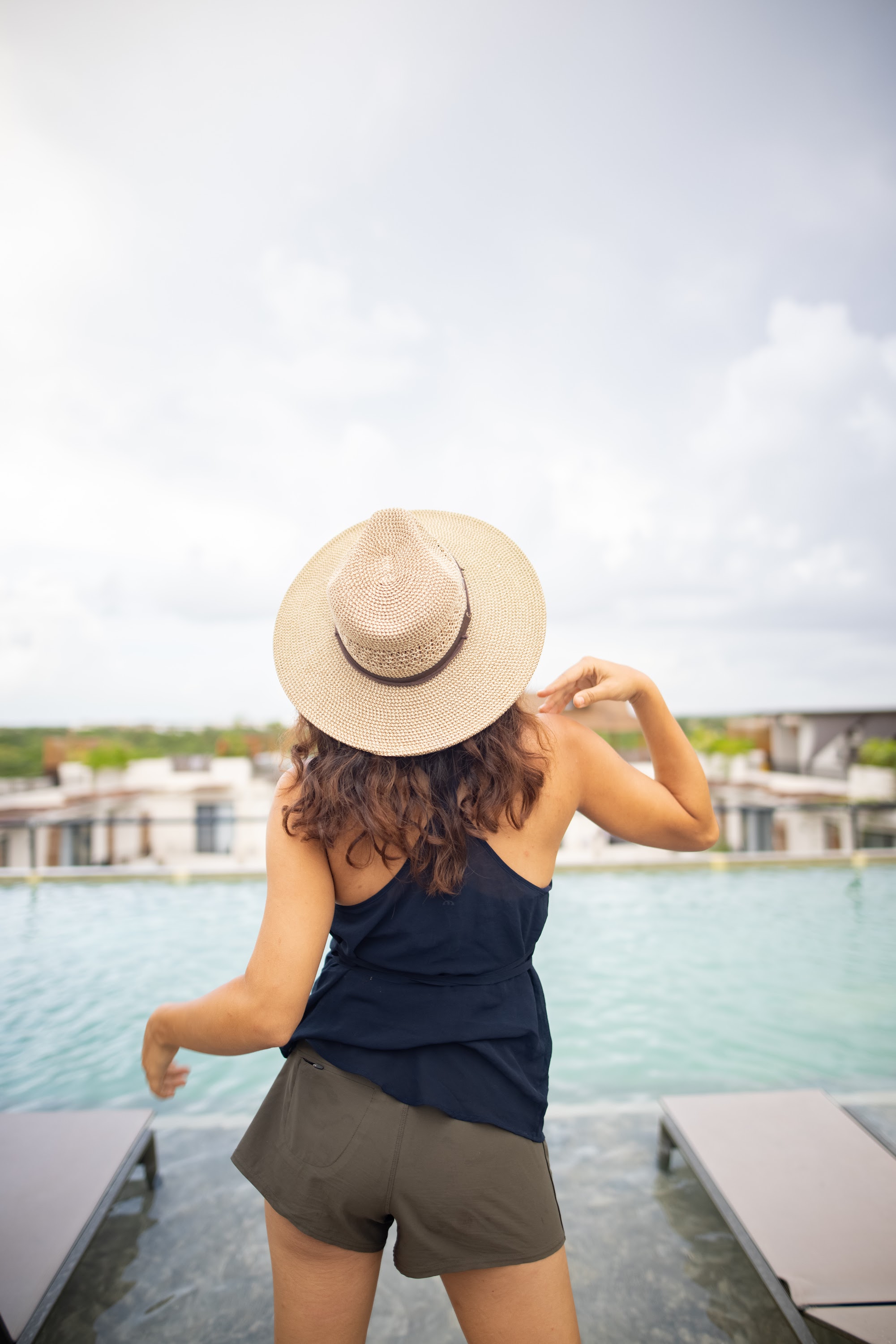 Woman in Straw Hat by Poolside