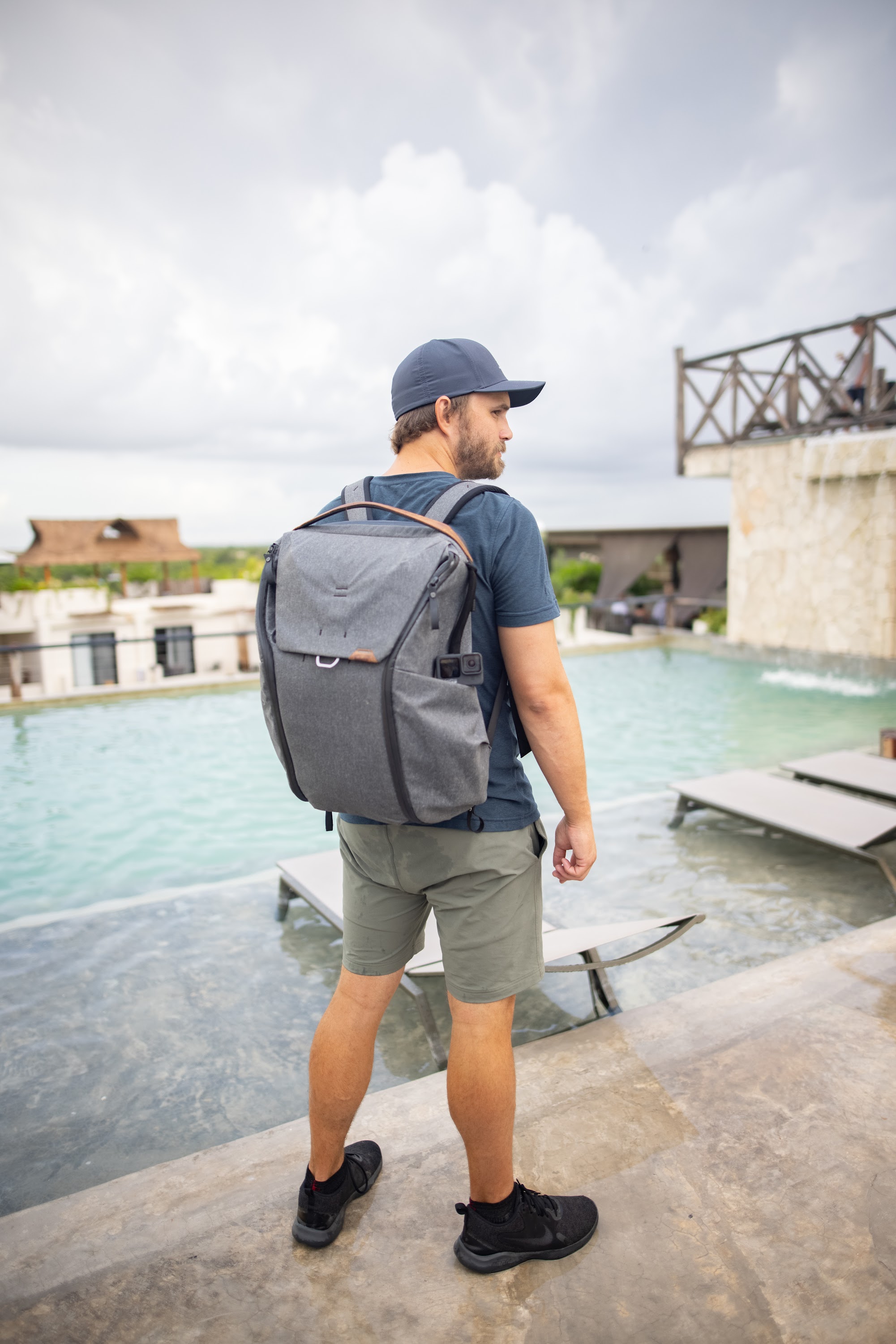 Man with Backpack by Poolside