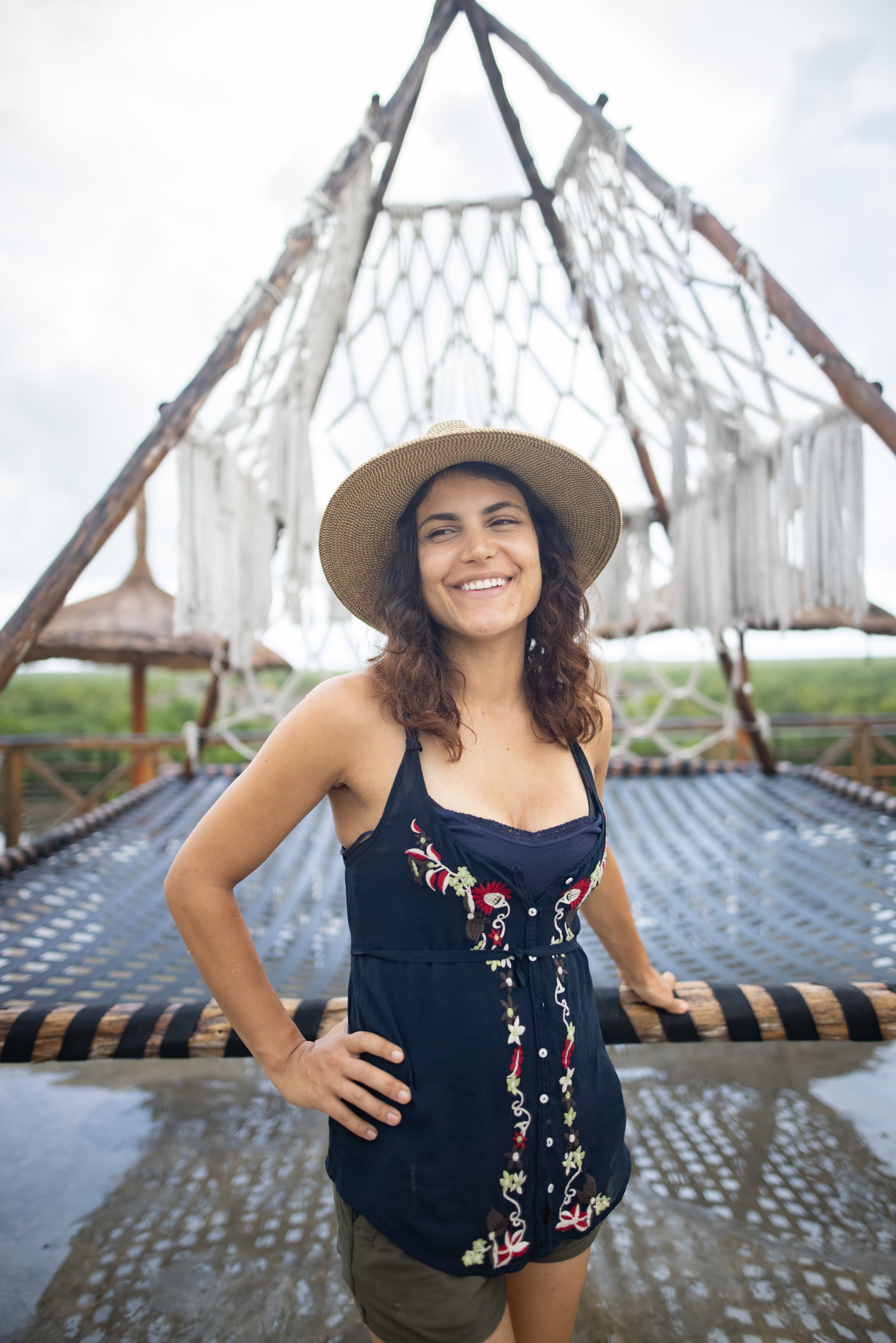 Smiling Woman in Straw Hat on Rope Deck