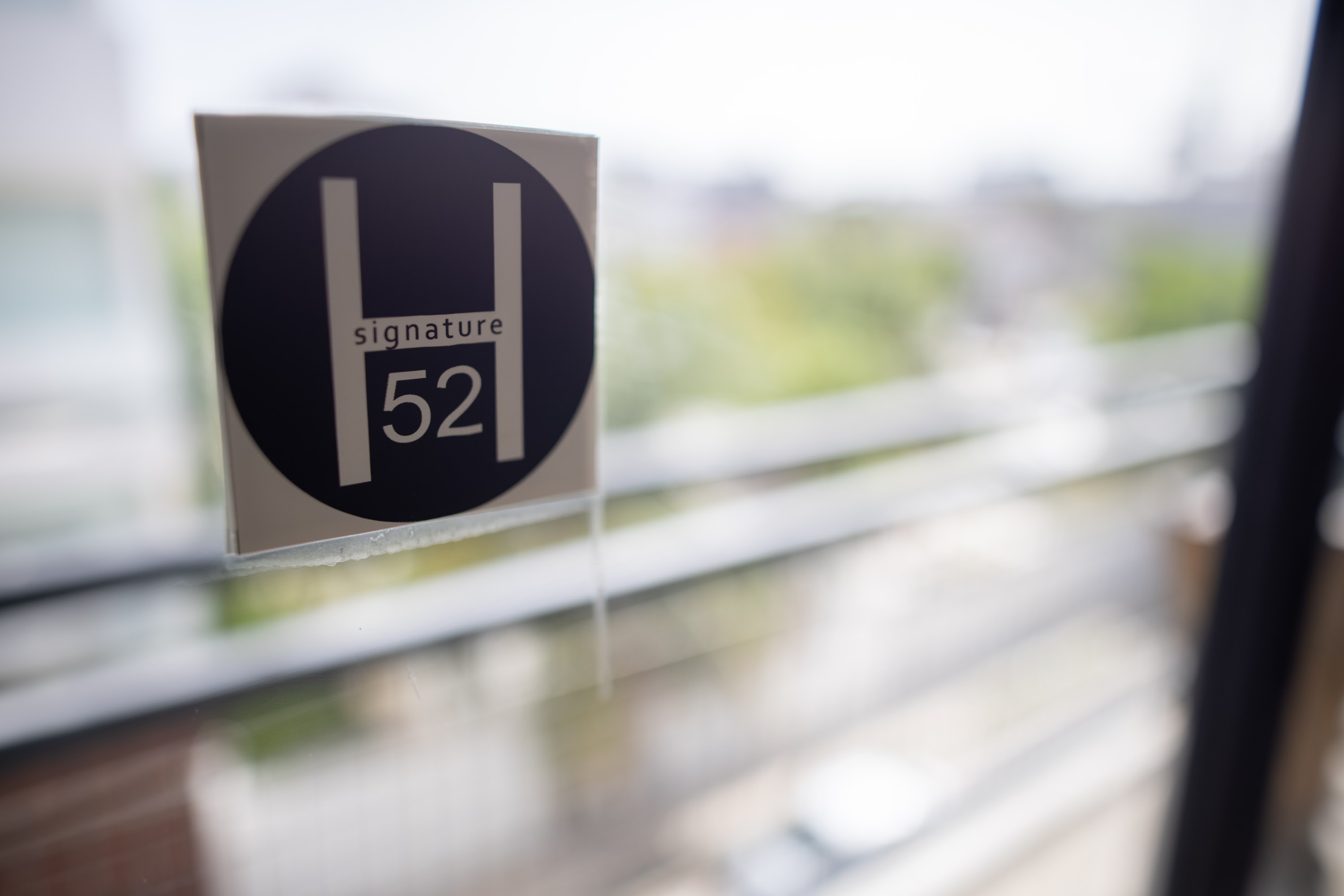 H Signature 52 Sticker on Glass Door