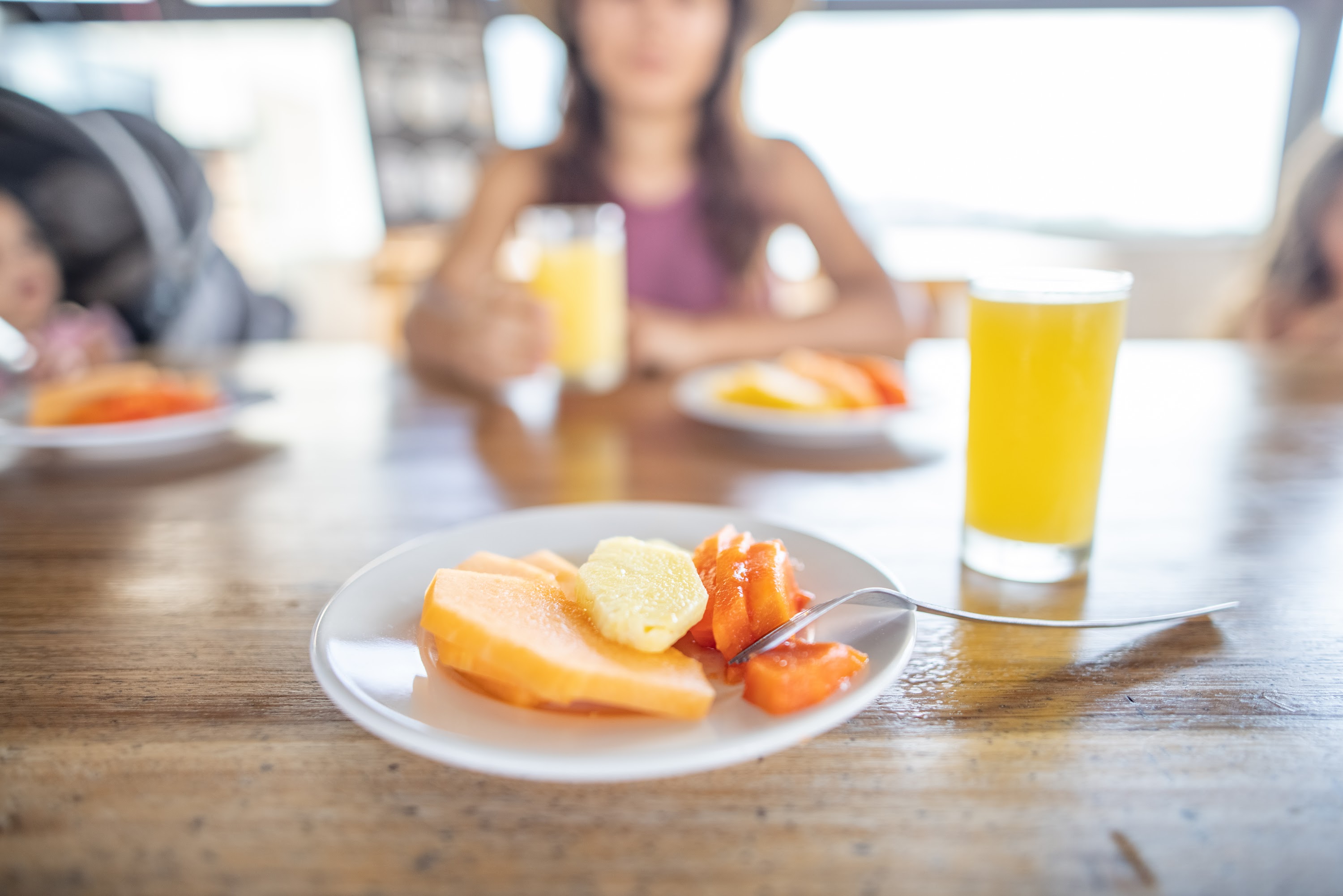Fruit Plate and Orange Juice on Wooden Table