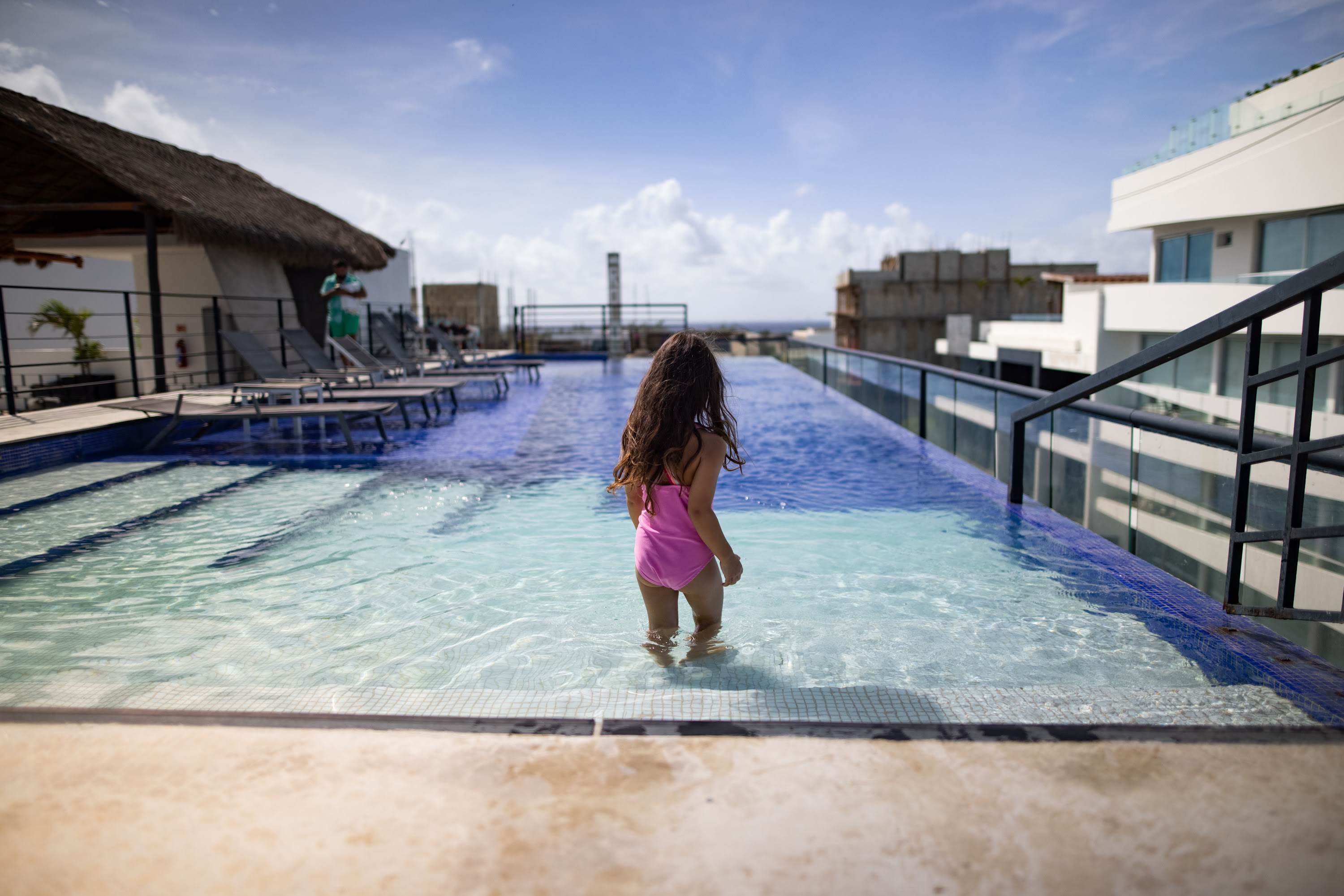 Girl in Pink Swimwear Walking in Rooftop Pool