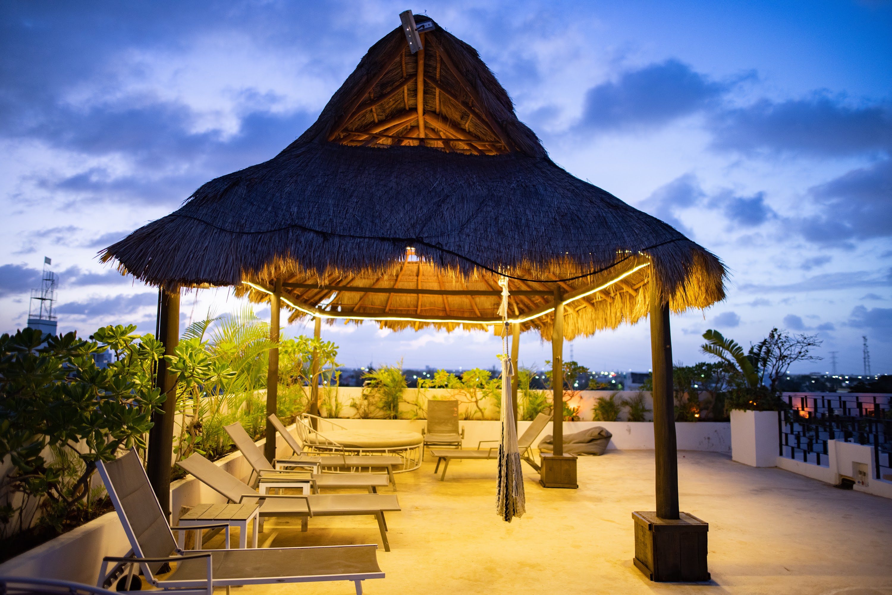 Rooftop Thatched Gazebo at Dusk