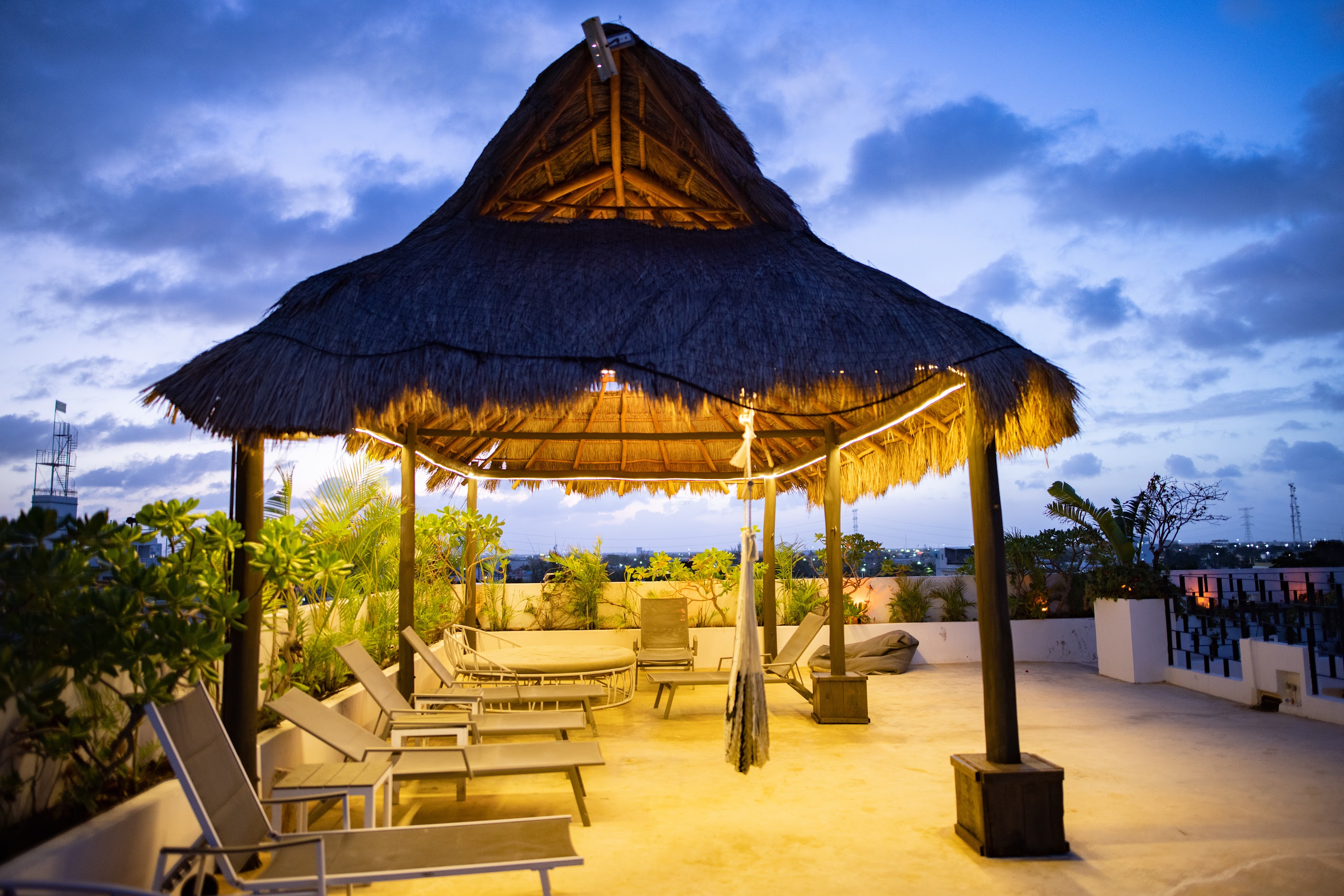 Rooftop Thatched Gazebo at Dusk