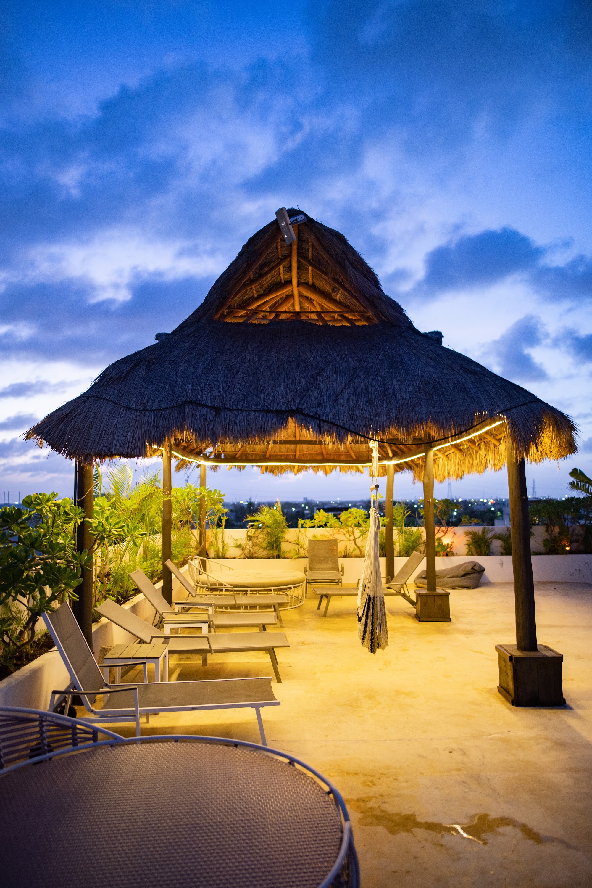 Rooftop Thatched Gazebo at Dusk