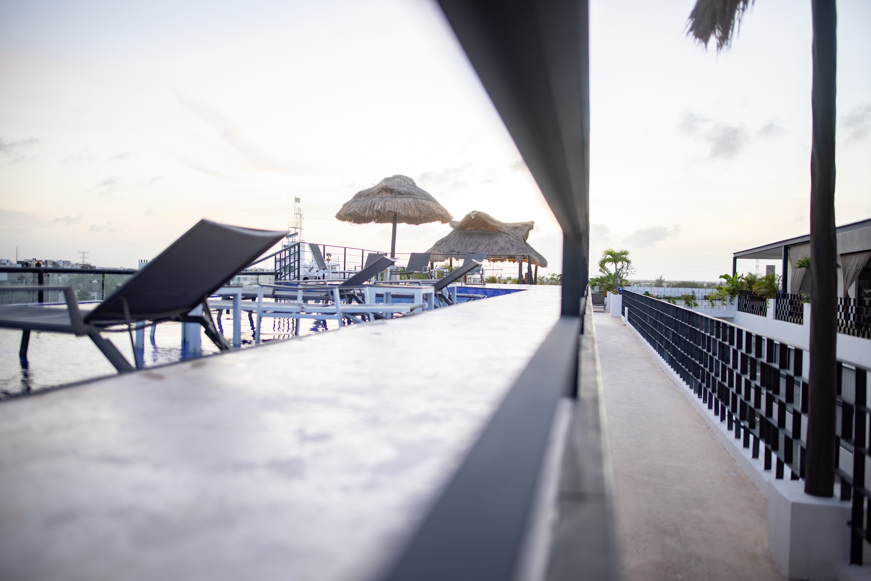 Rooftop Poolside Relaxation at Sunset