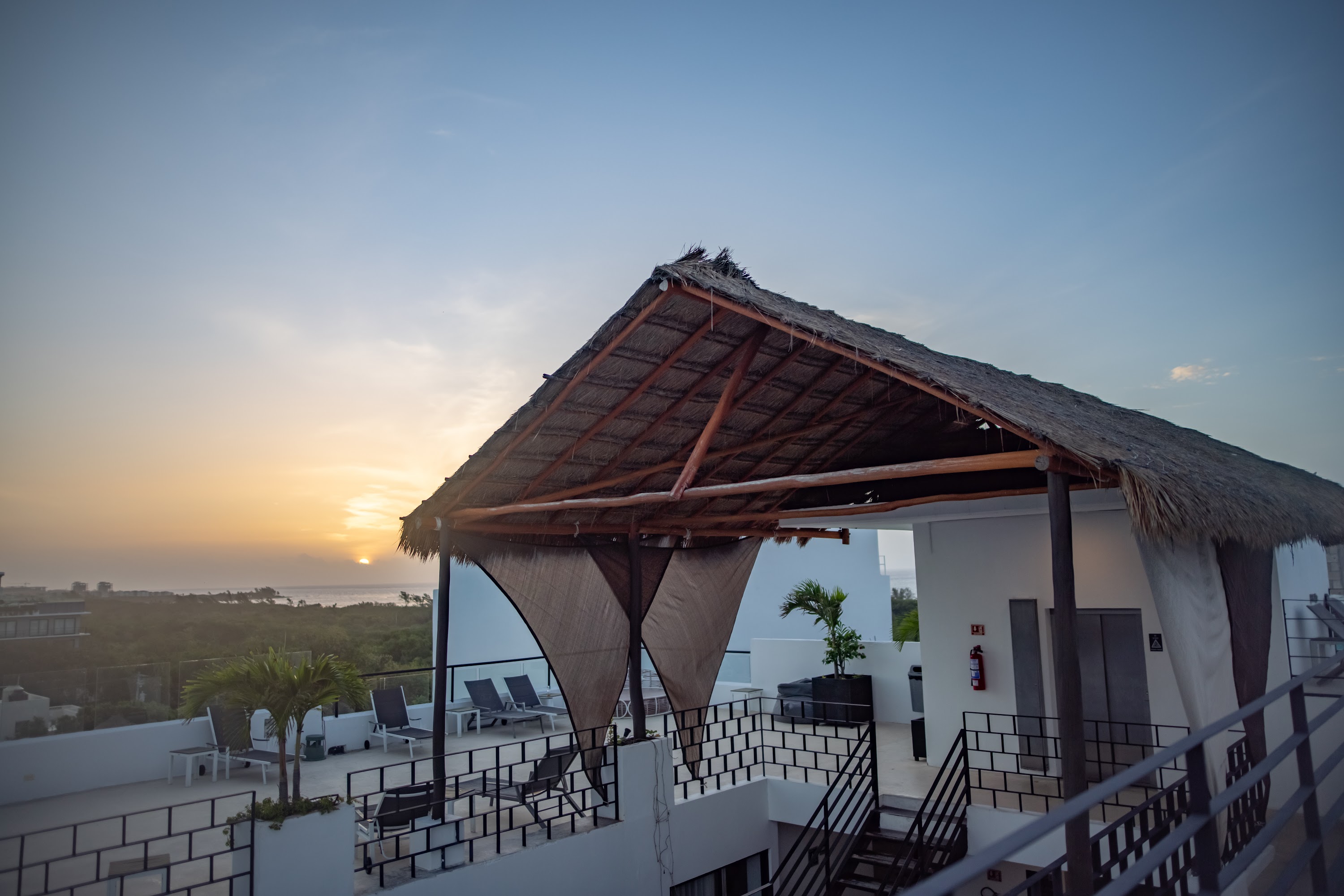 Sunset at Rooftop Terrace with Thatched Pavilion