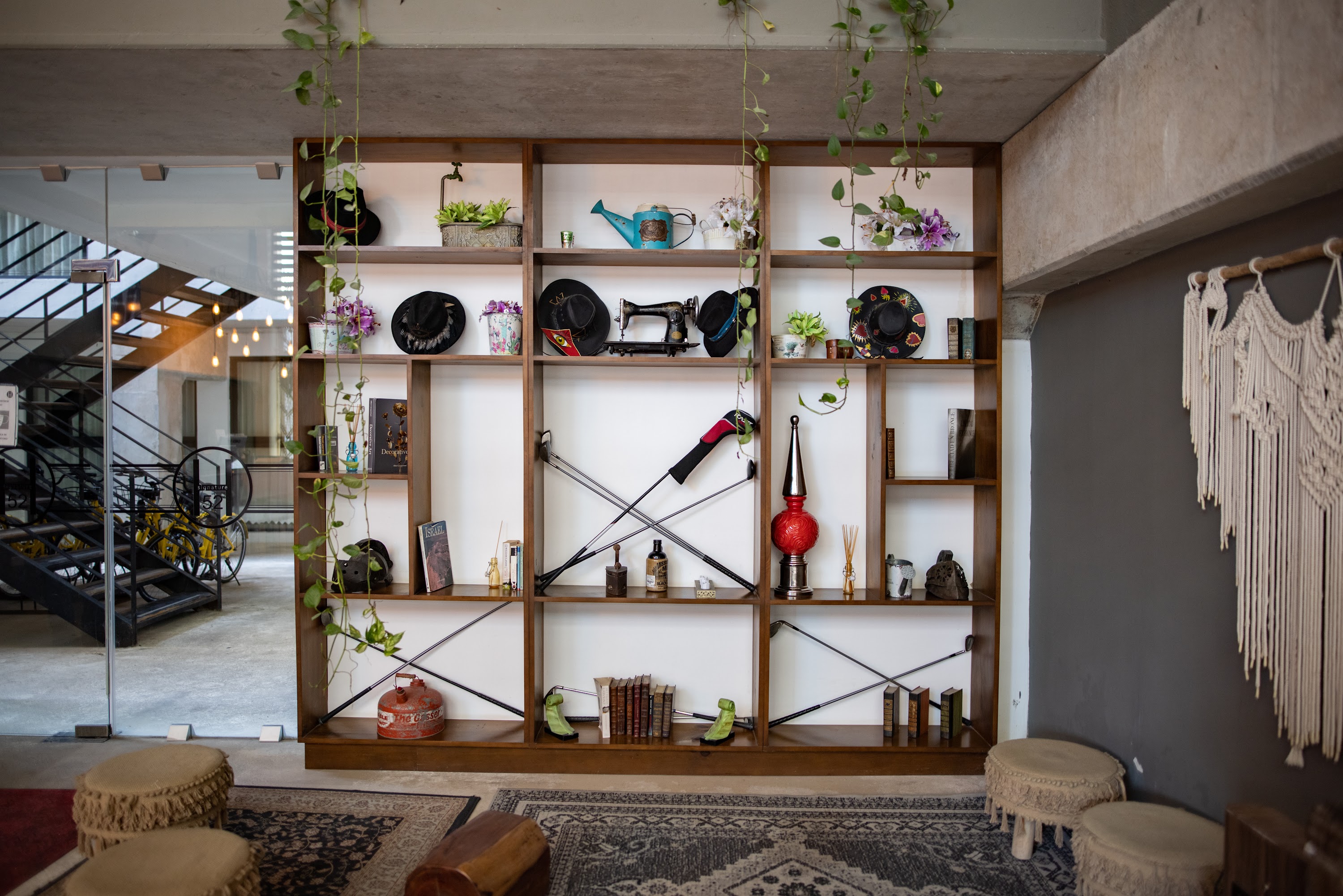 Bohemian Bookshelf Display with Vintage Decor and Hanging Plants