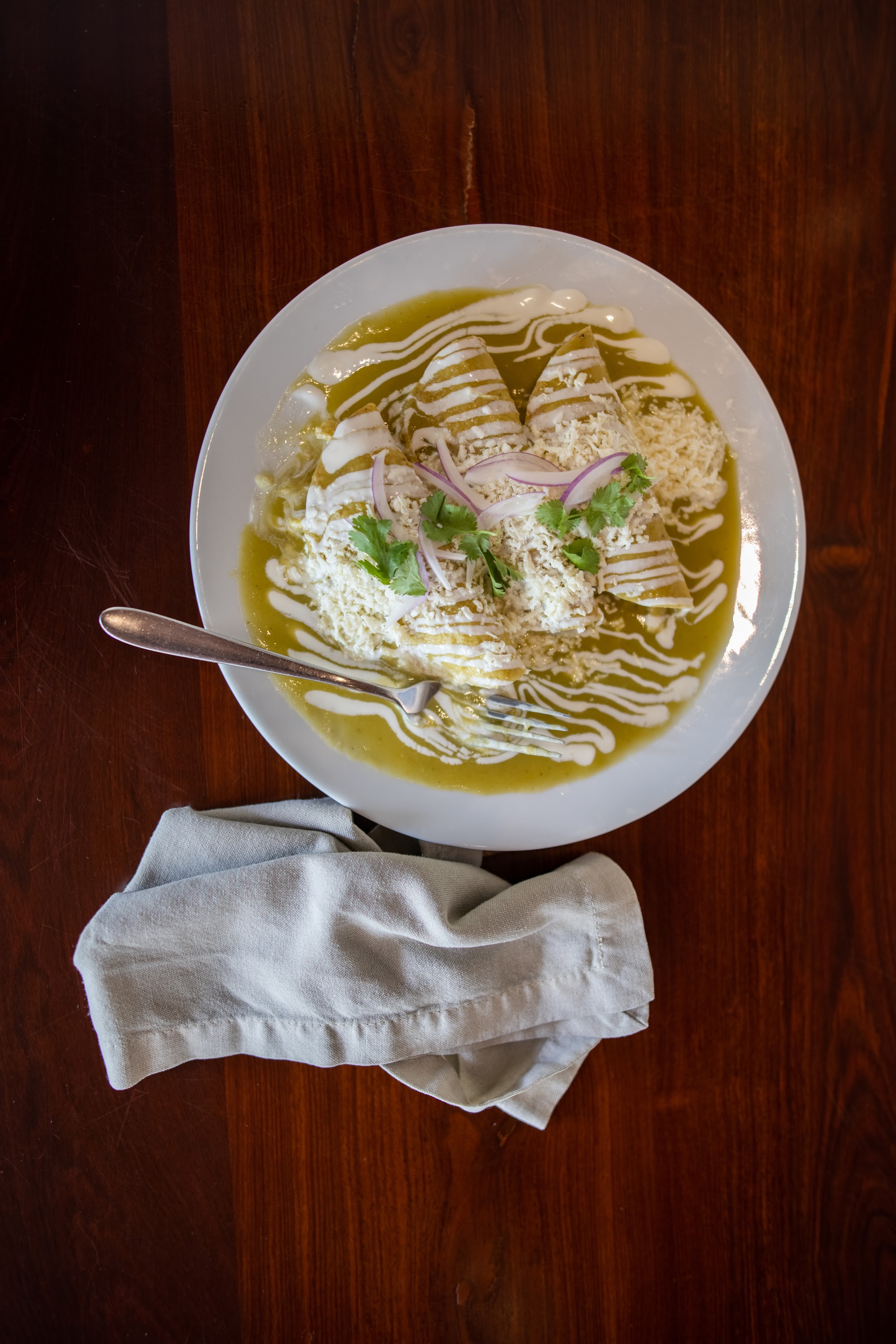 Enchiladas Verdes on a Wooden Table