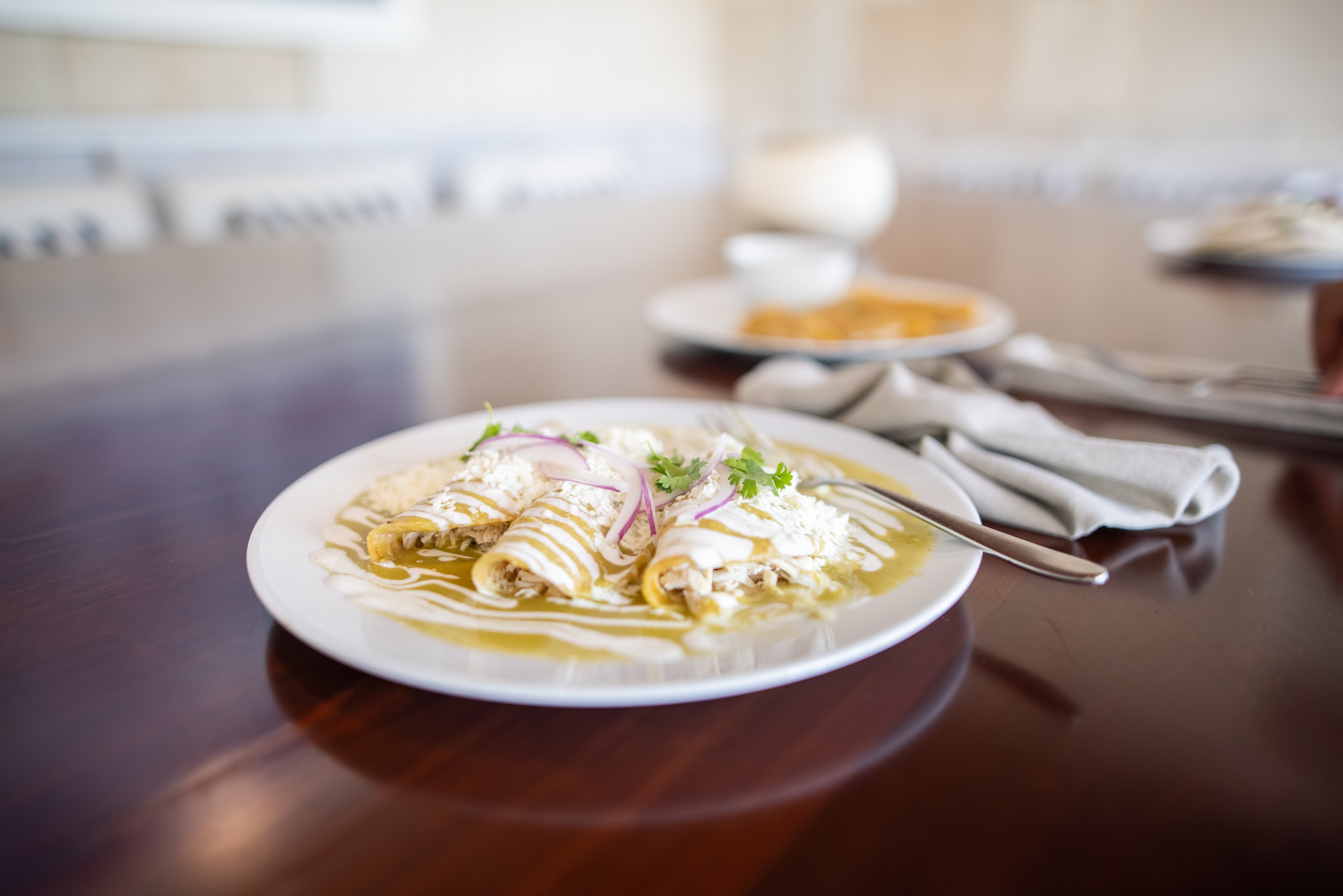 Enchiladas Verdes on a Wooden Table