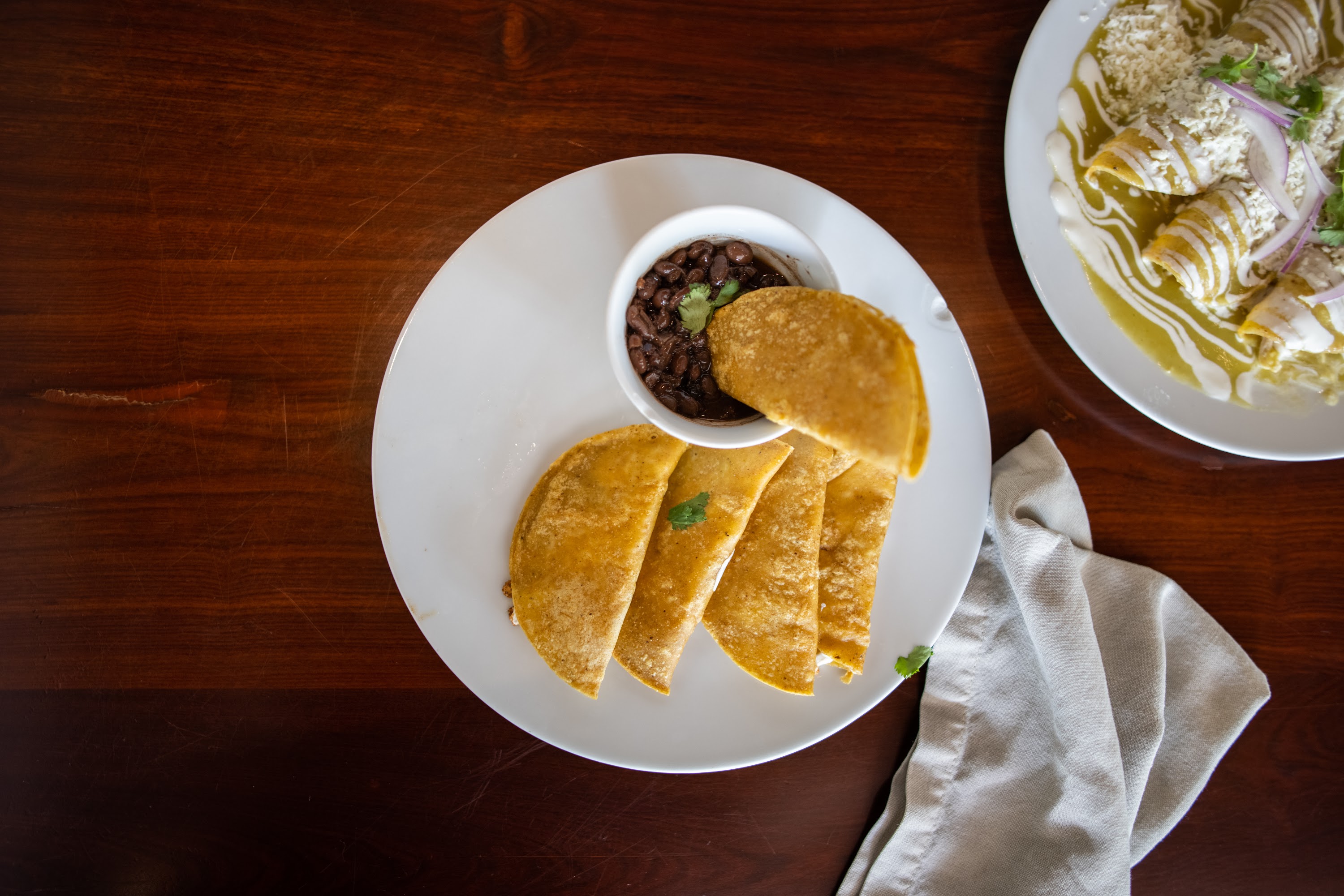 Tacos and Black Beans on a Wooden Table