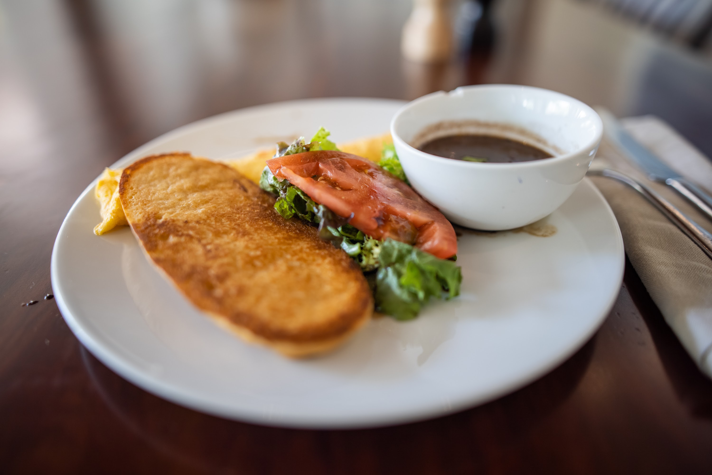 Breakfast Plate with Toast, Omelette, Salad, and Sauce
