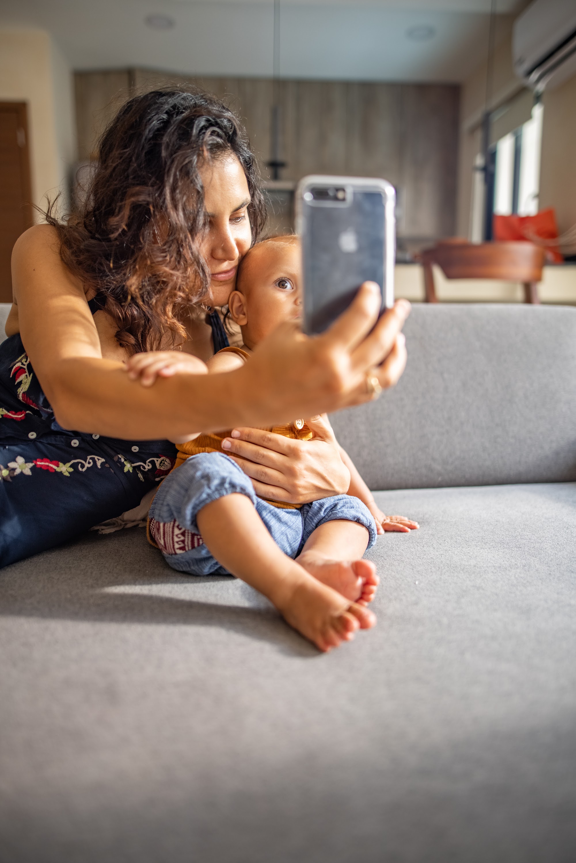 Mother and Baby Taking Selfie on Couch
