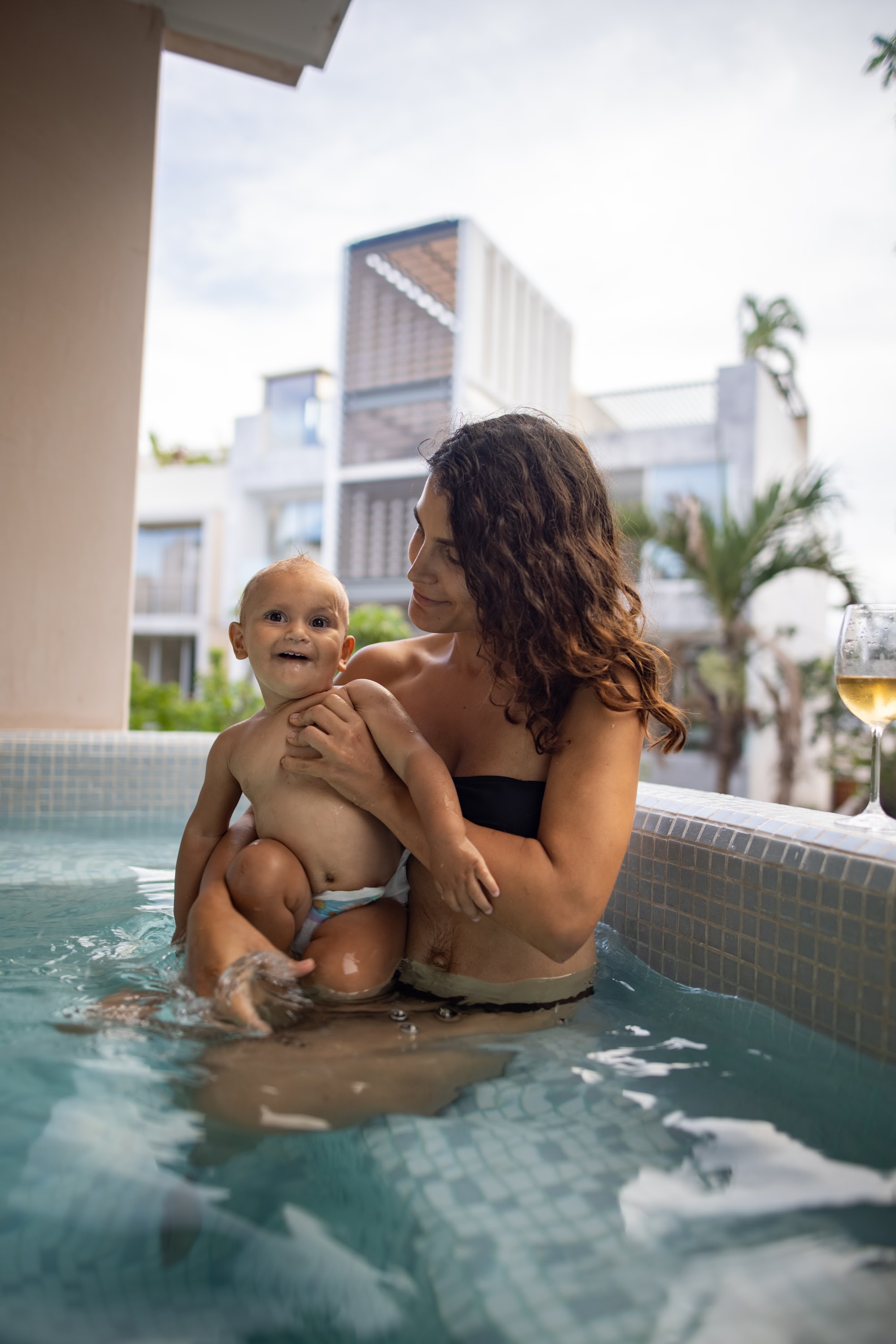 Mother and Baby in Pool with Wine