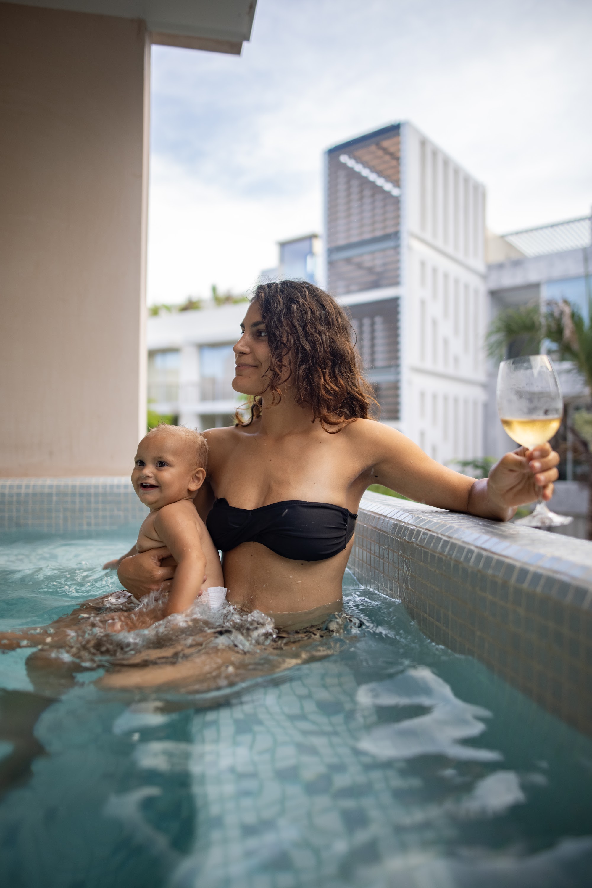 Mother and Baby in Pool with Wine