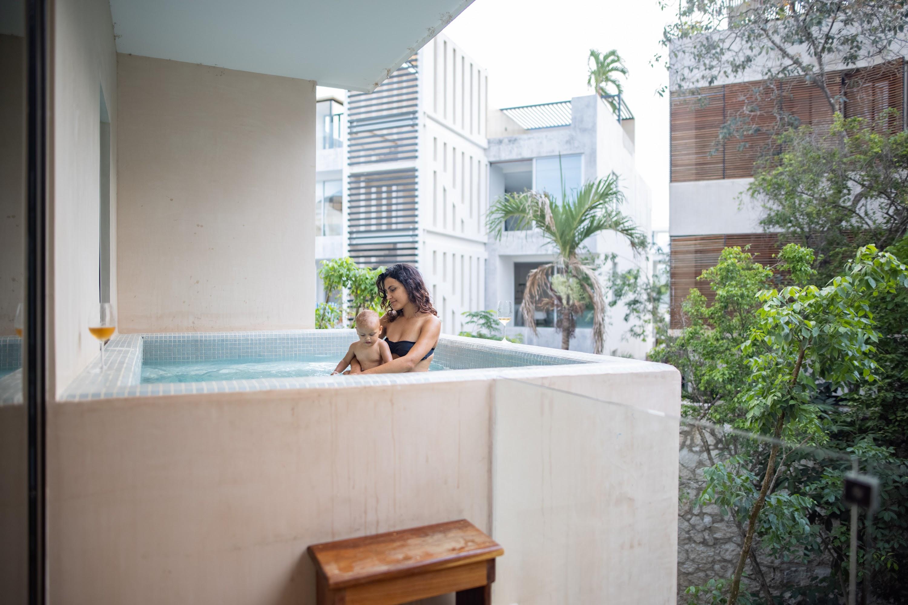 Mother and Baby Relaxing in Private Outdoor Hot Tub