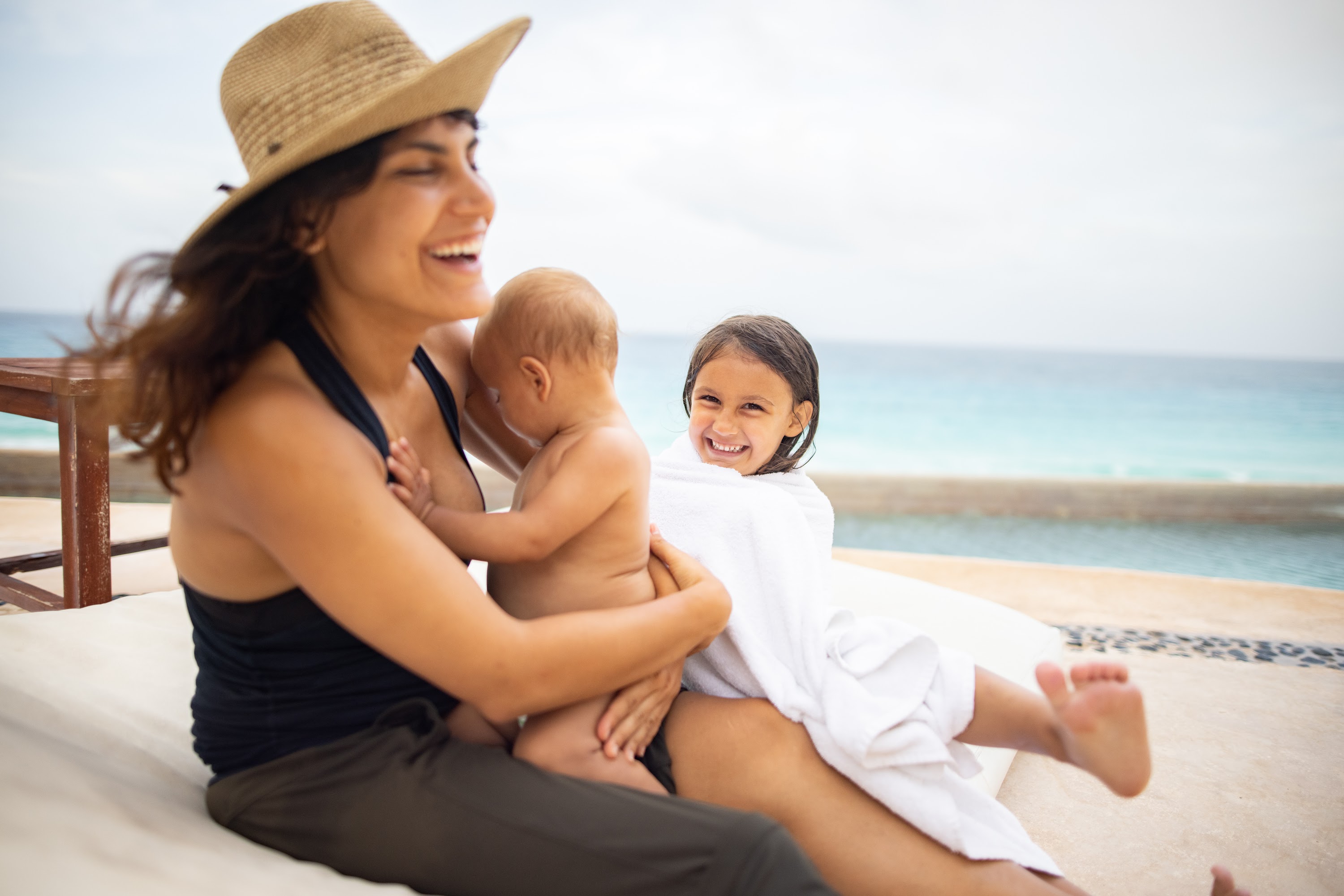 Mother and children enjoying beachside relaxation