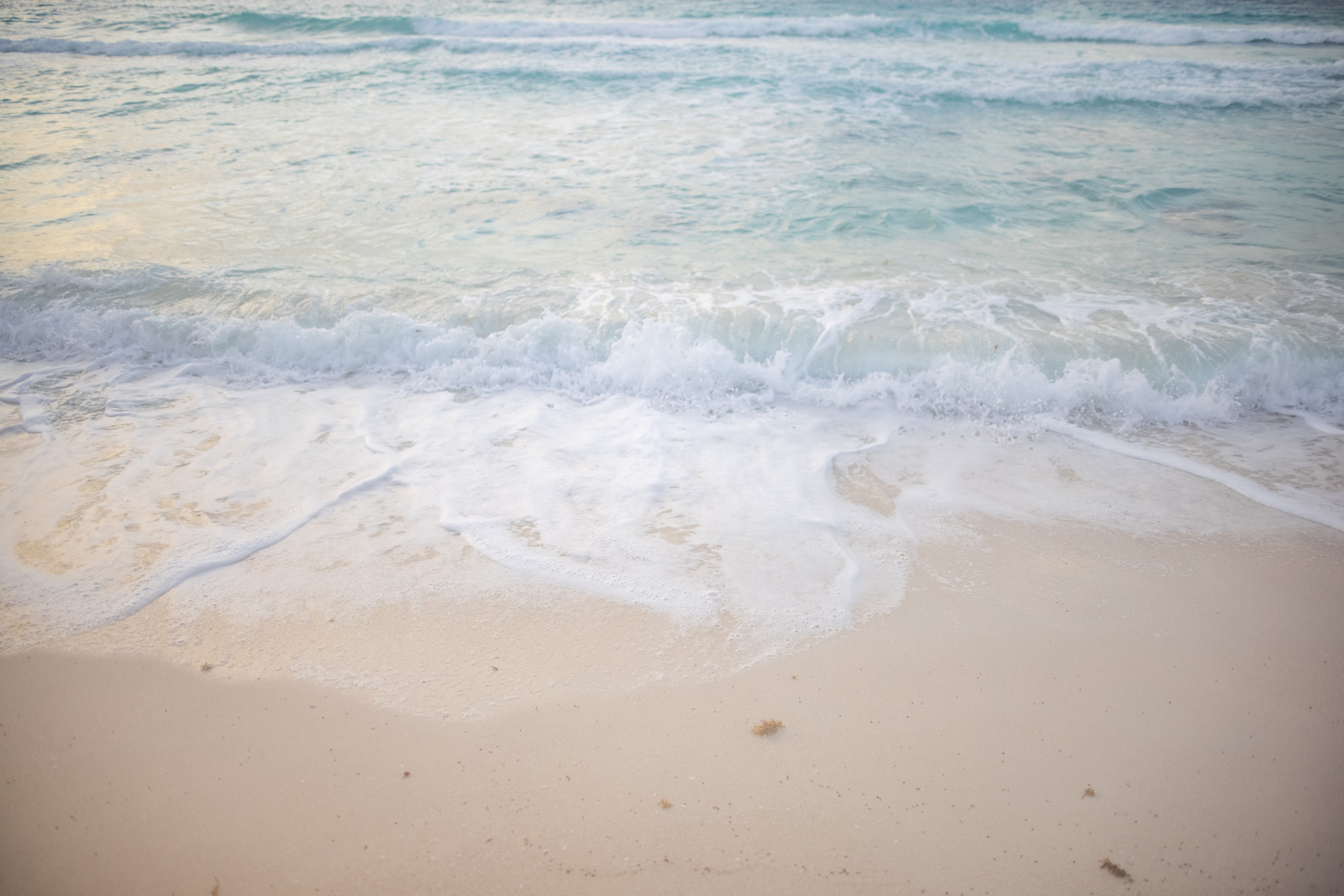 Gentle Ocean Waves Washing Ashore on a Sandy Beach
