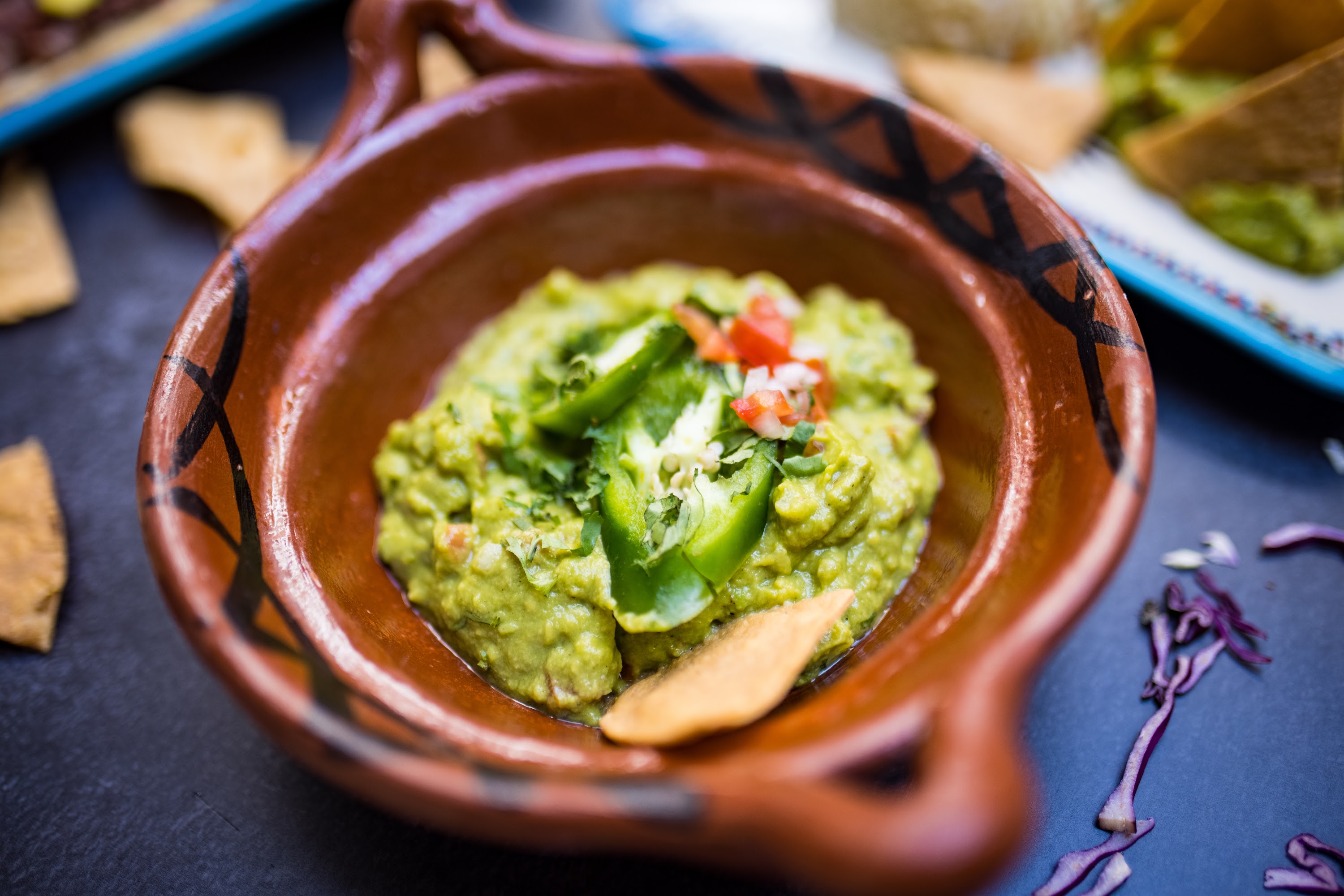 Fresh Guacamole in Traditional Clay Bowl
