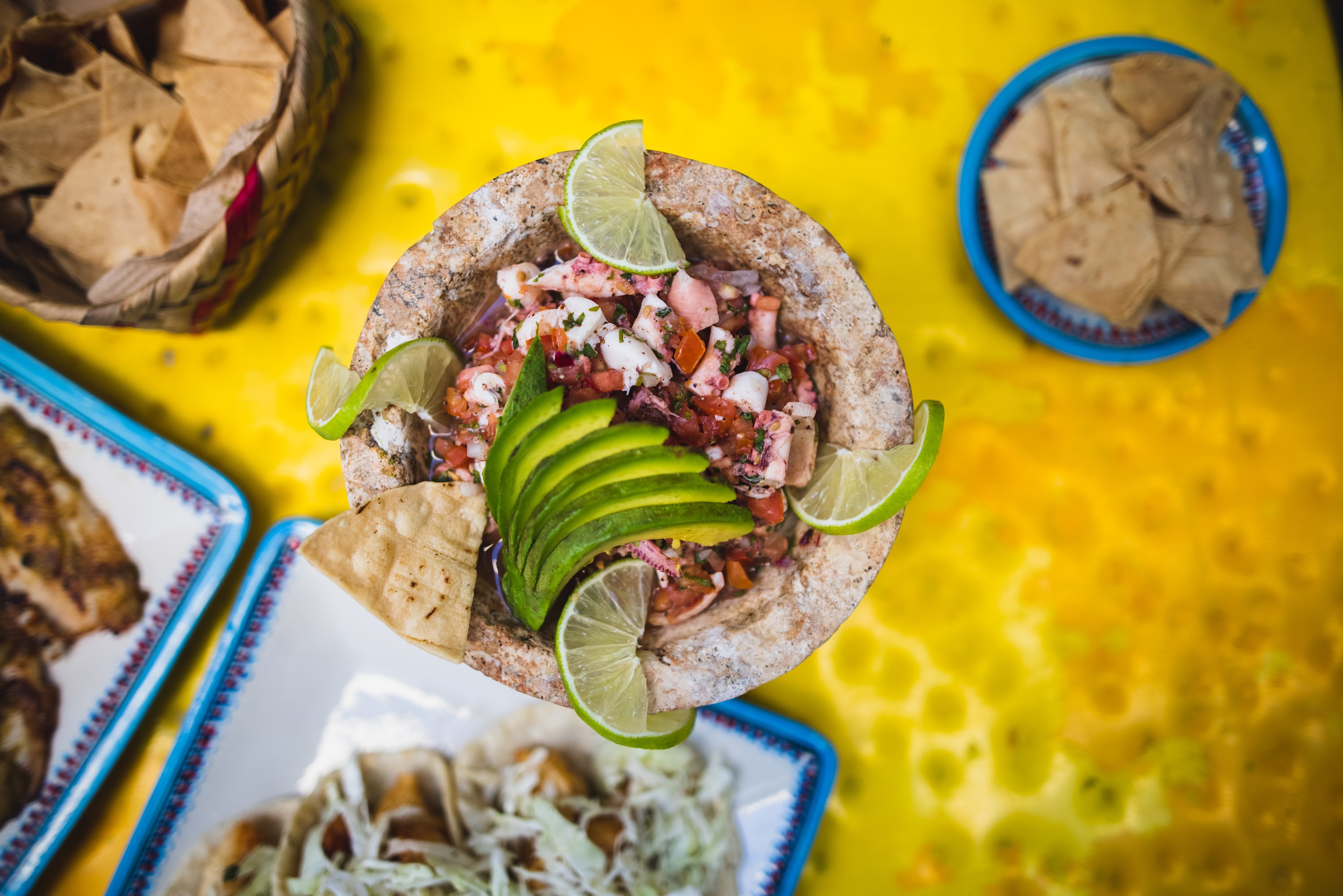 Fresh Seafood Ceviche in a Stone Mortar with Avocado and Lime