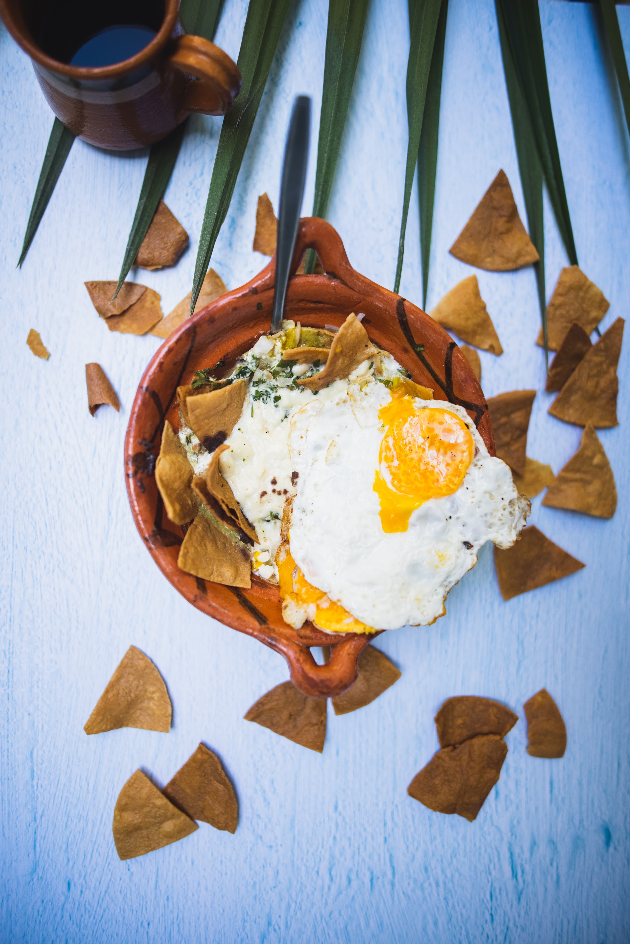 Chilaquiles with Fried Egg in Clay Bowl