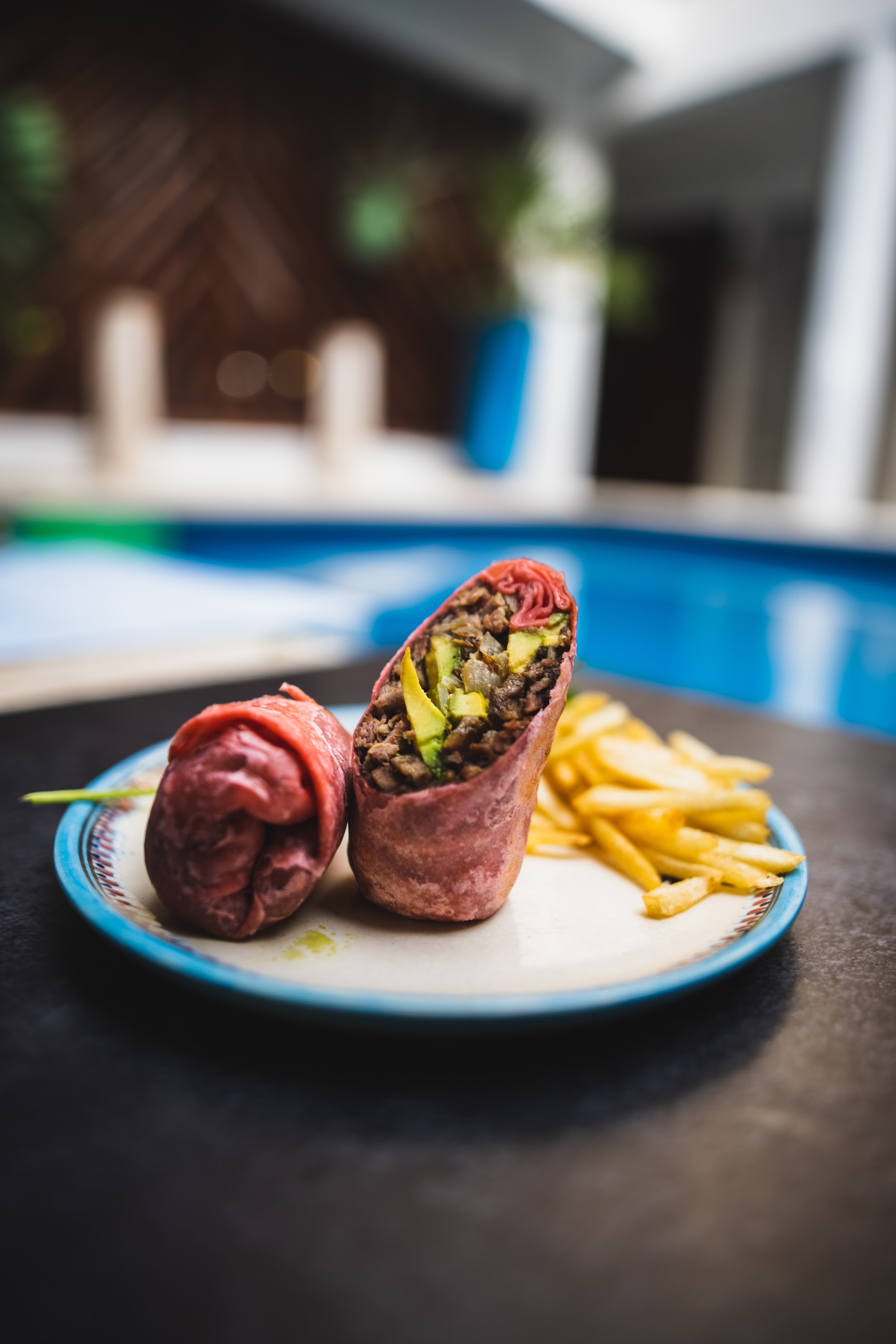 Grilled Meat Wrap with Avocado and Fries by the Pool
