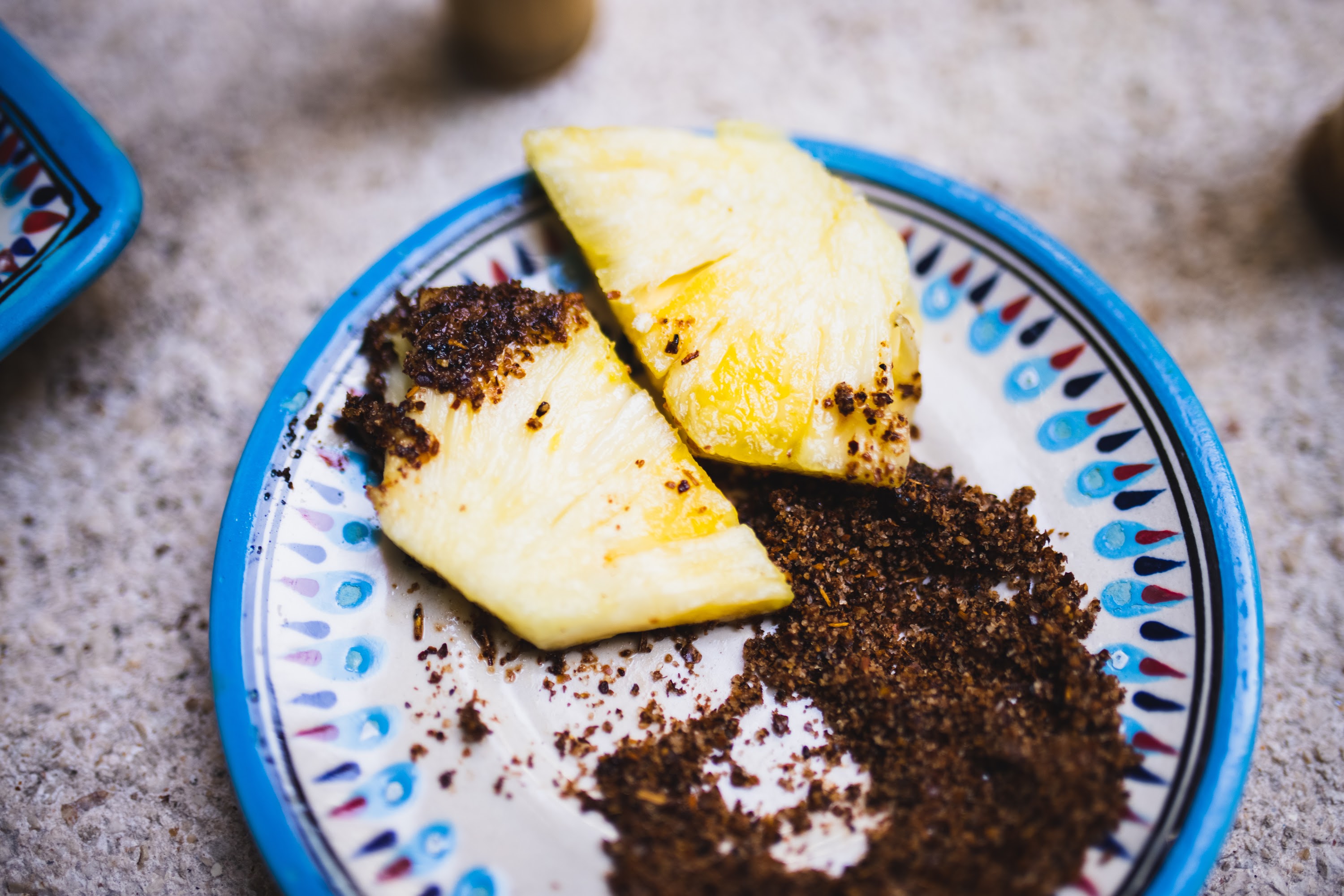 Pineapple Slices with Spiced Sugar on Patterned Plate