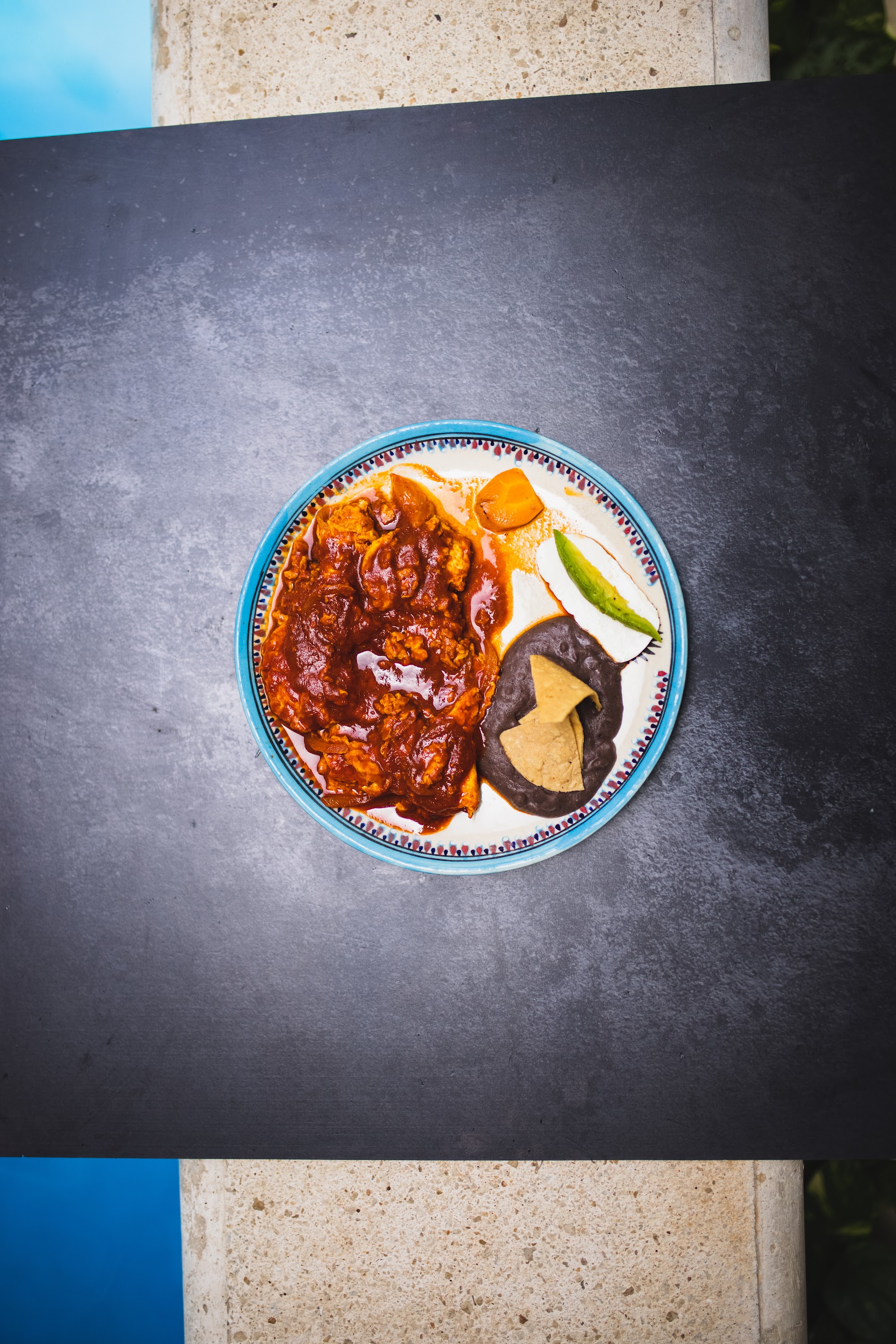 Top-down view of Mexican meal on patterned plate