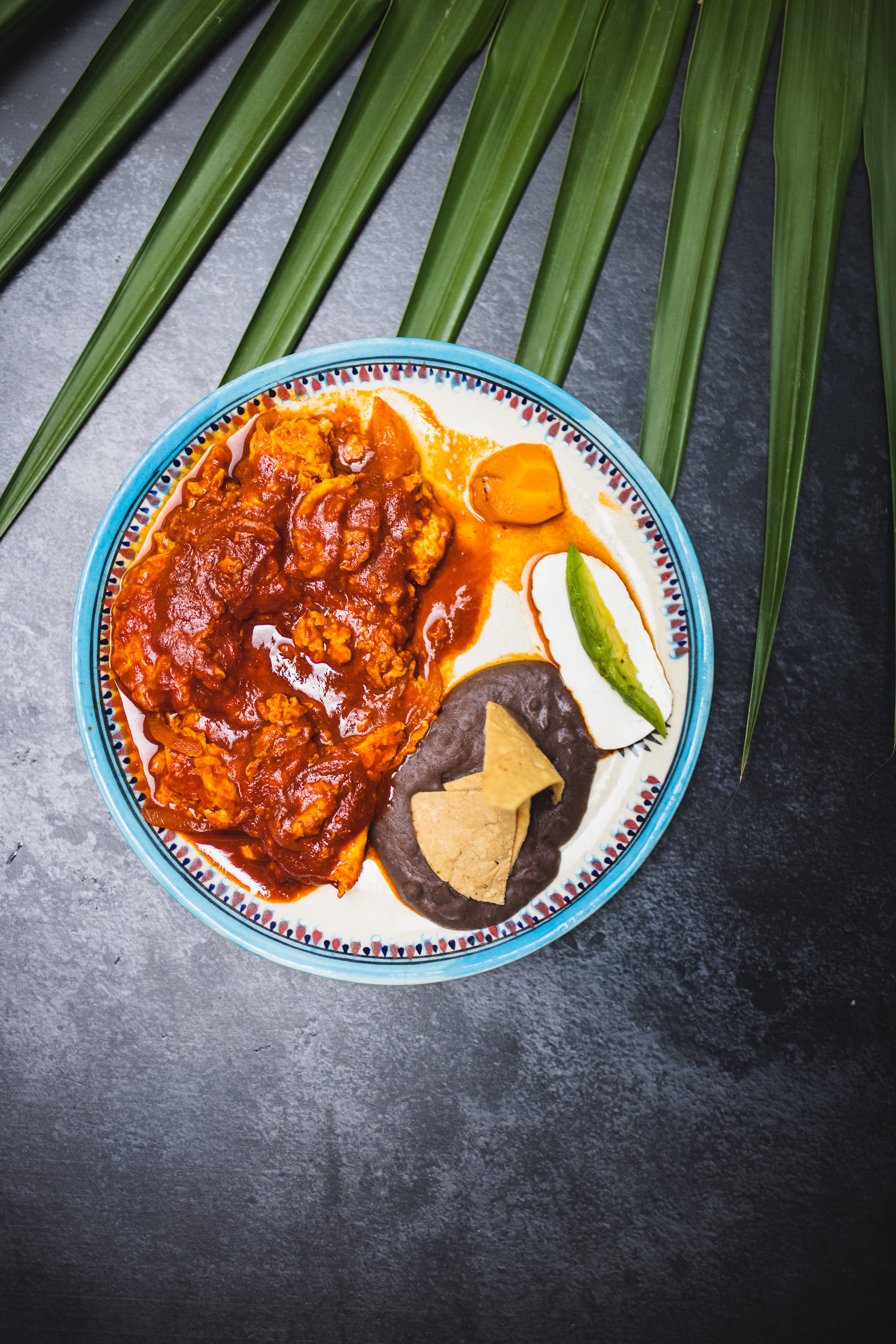 Mexican-style dish with mole, black beans, and lime
