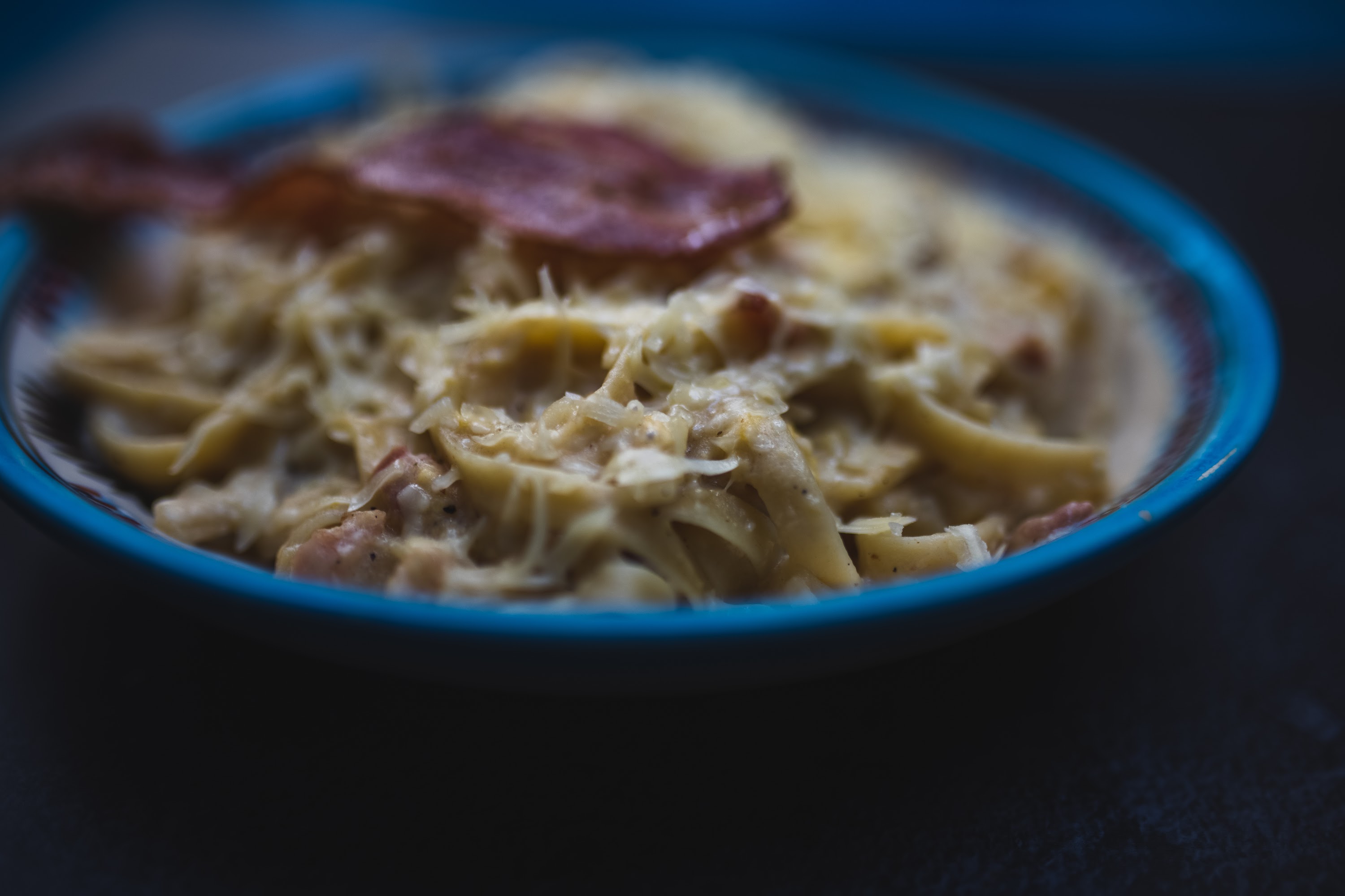 Creamy Pasta with Bacon on a Blue Bowl
